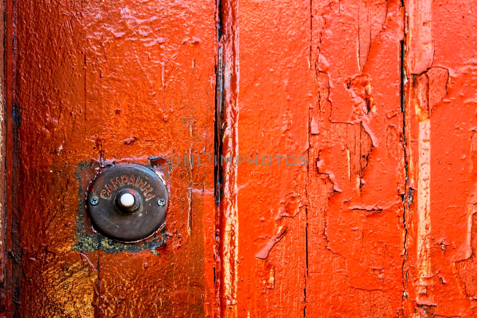 Rusty Doorbell in Old colorful door in Lisbon, Portugal