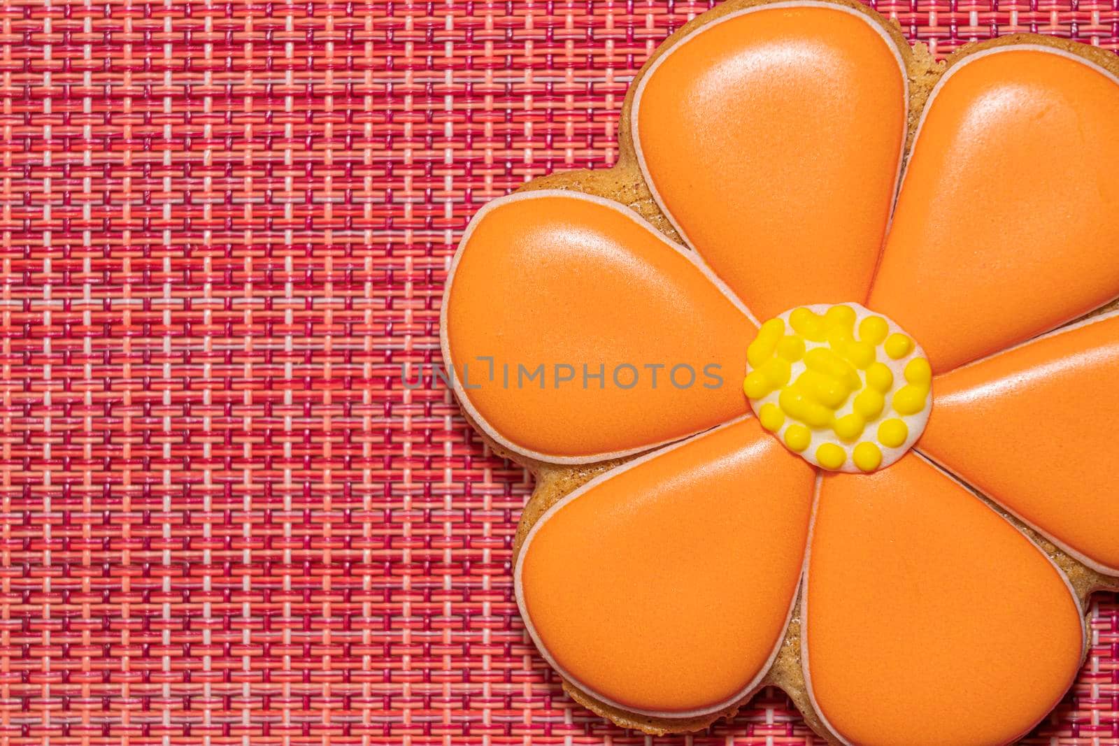 ginger cookies in the form of a flower on a red background. High quality photo