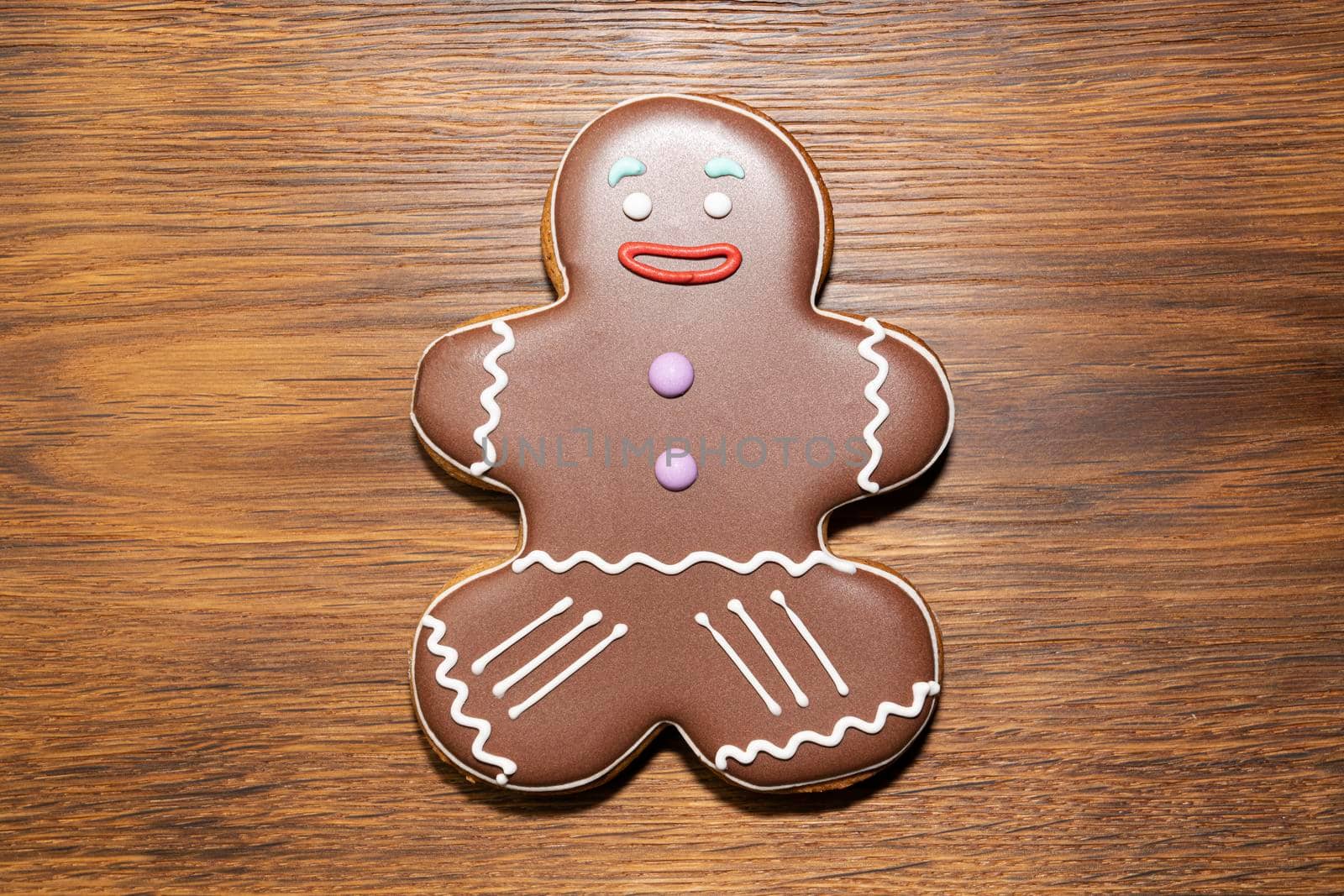 ginger cookies in the form of a man on a wooden background. High quality photo