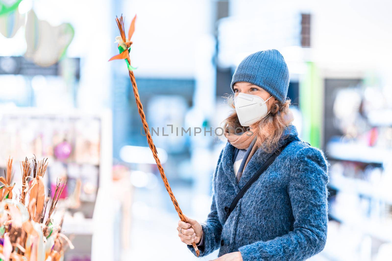 Easter rod in the hand of a young woman in the store.