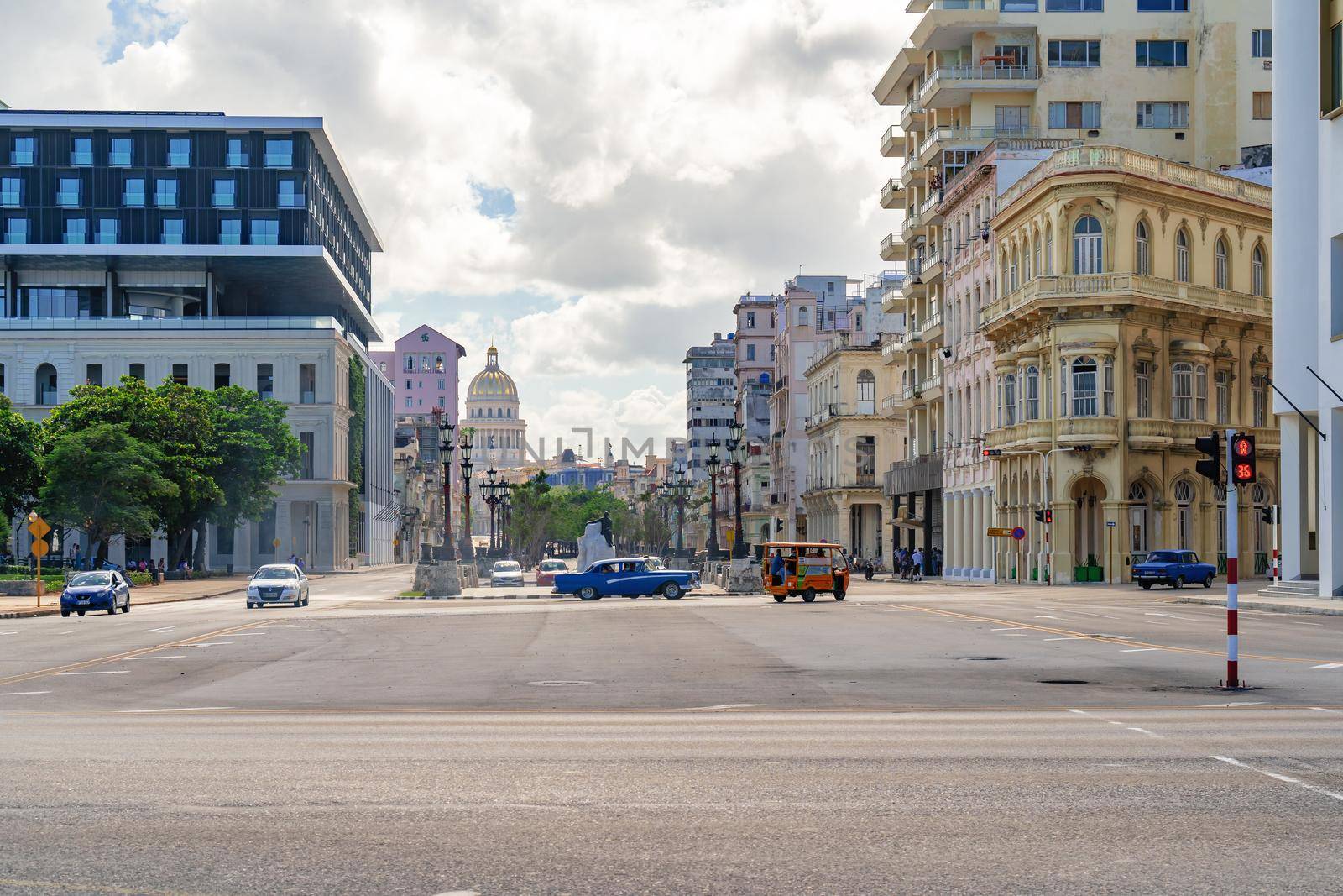 Havana Cuba. November 25, 2020: Horizontal photo of Paseo del Prado and Paseo de Marti avenue. Colonial buildings on the sides of the avenue and in the background the dome of the capitol of Havana. Places of historical, cultural and tourist value in Havana