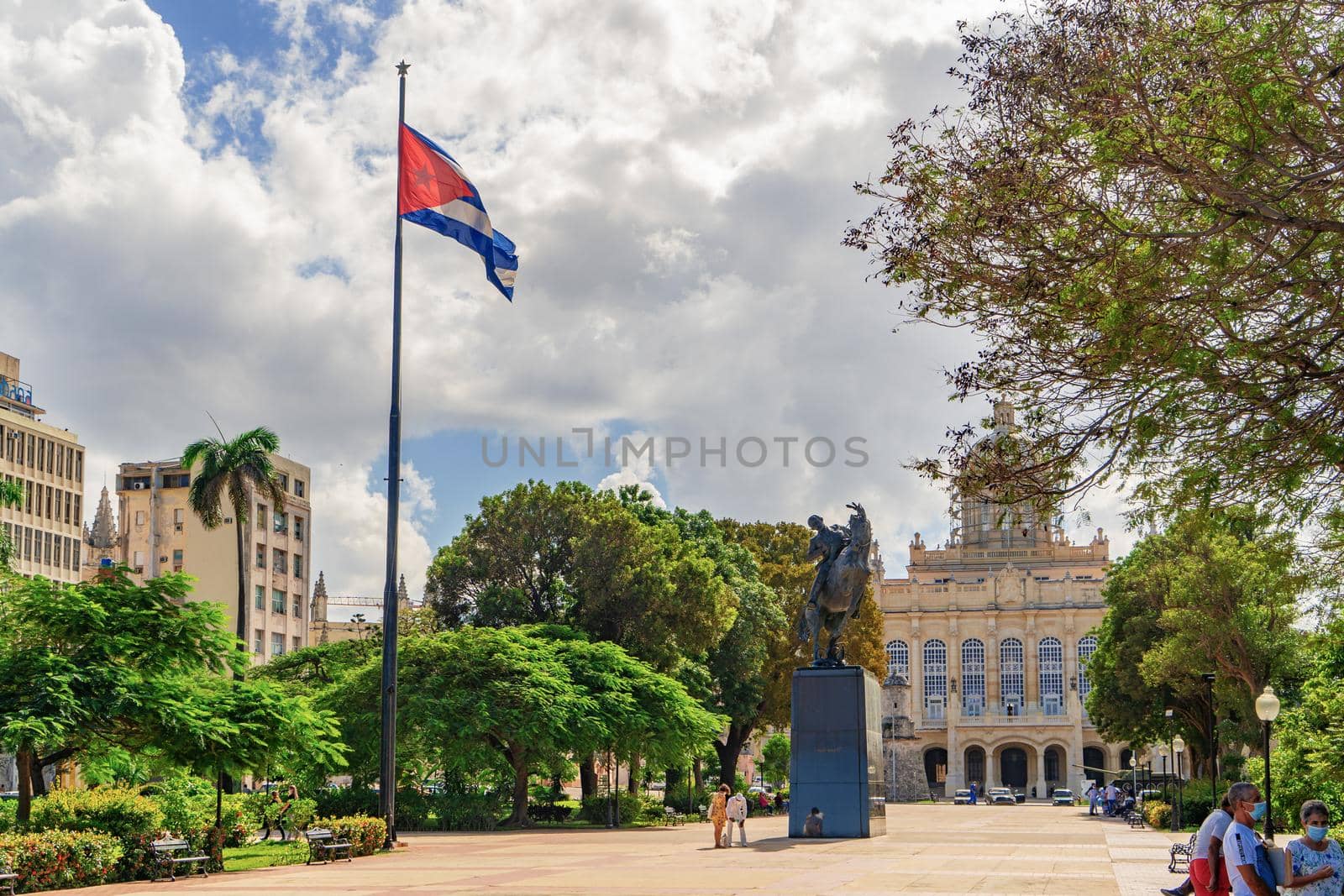 Havana Cuba. November 25, 2020: View of the Plaza 13 de Marzo with the Cuban flag waving on a pole and the statue of Jose Marti riding his horse