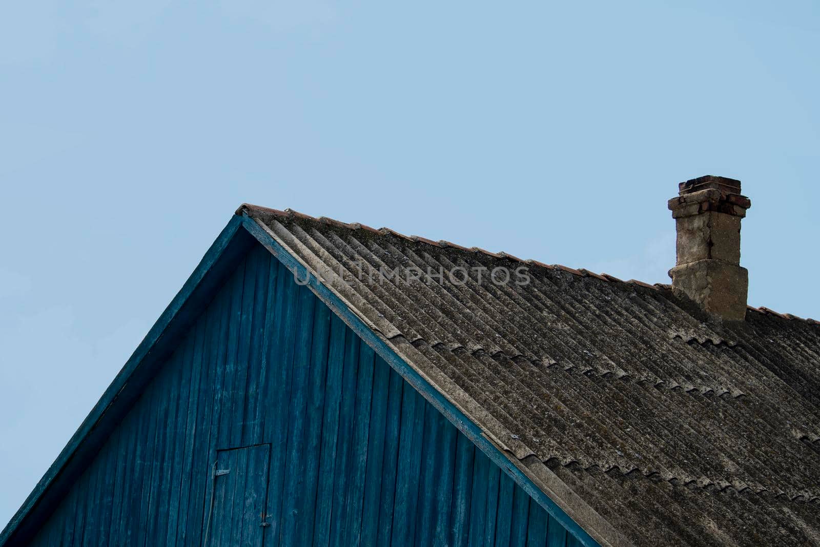 The roof with the pipe on the old house.