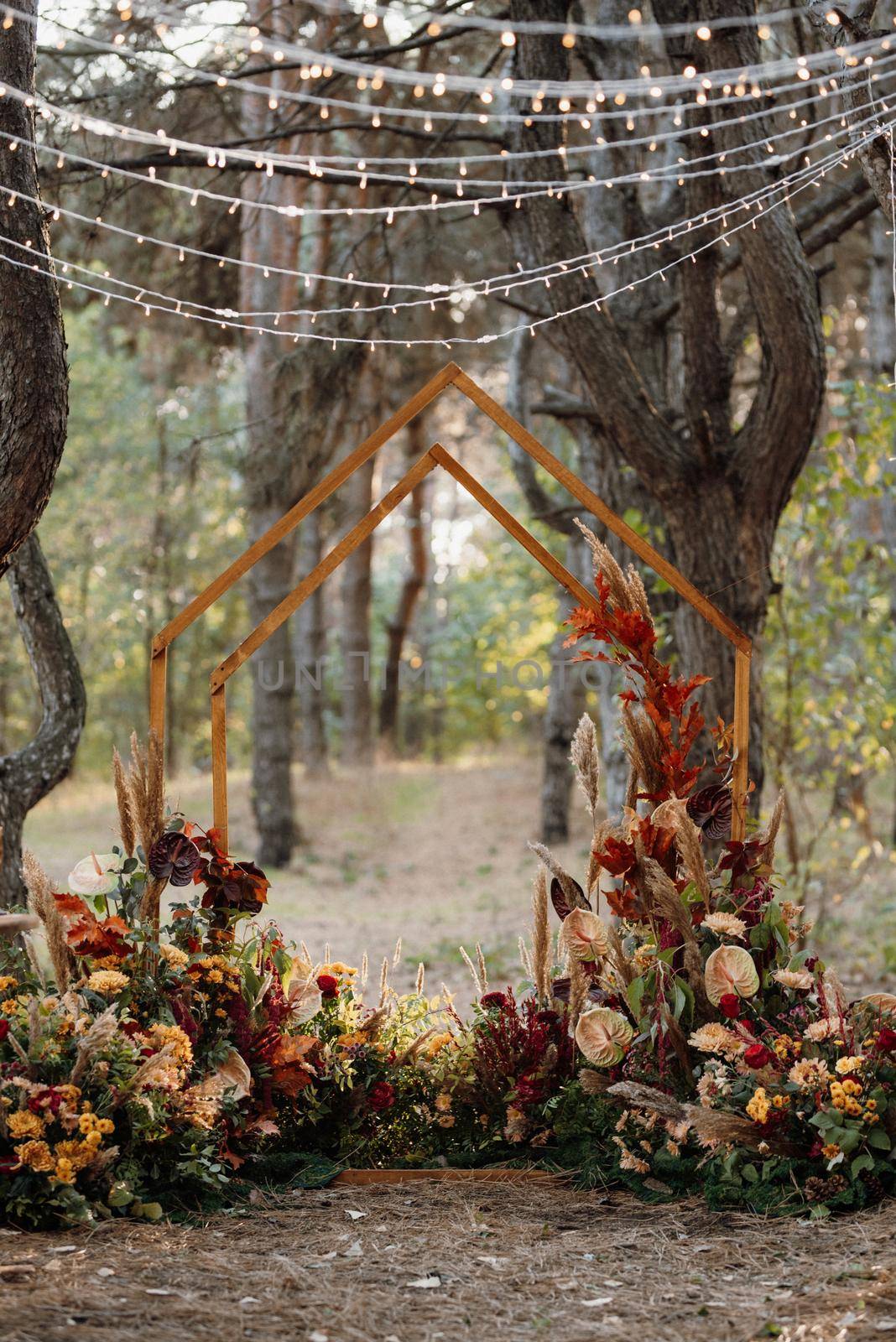 wedding ceremony area with dried flowers in a meadow in a pine brown forest