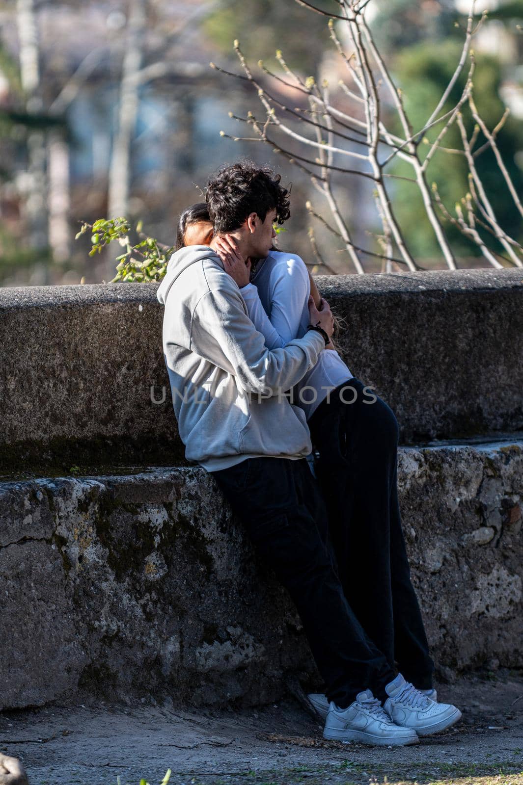 terni,italy march 25 2021:engaged couple hugging each other at the park