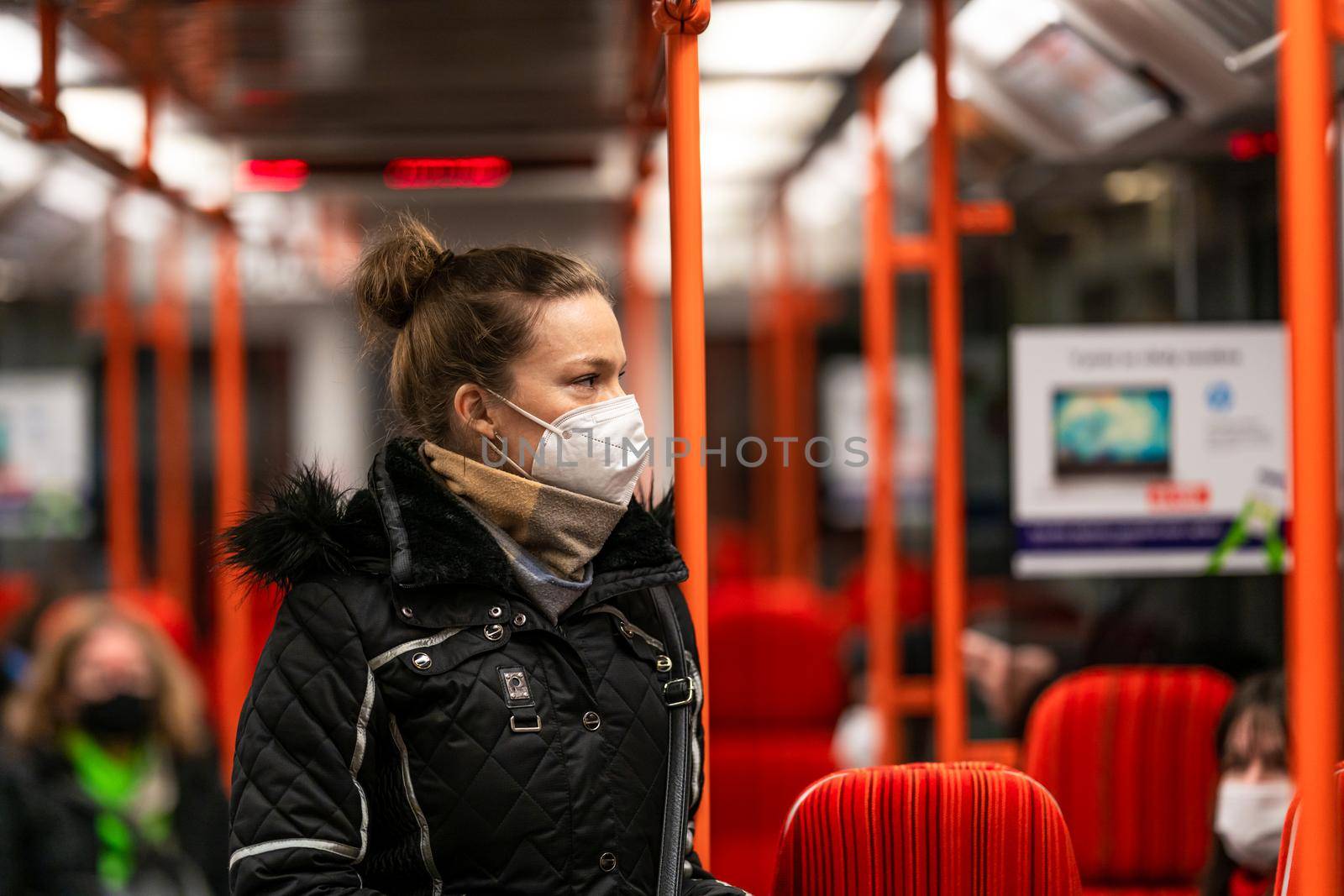 The woman travels by public transport around the city by Edophoto