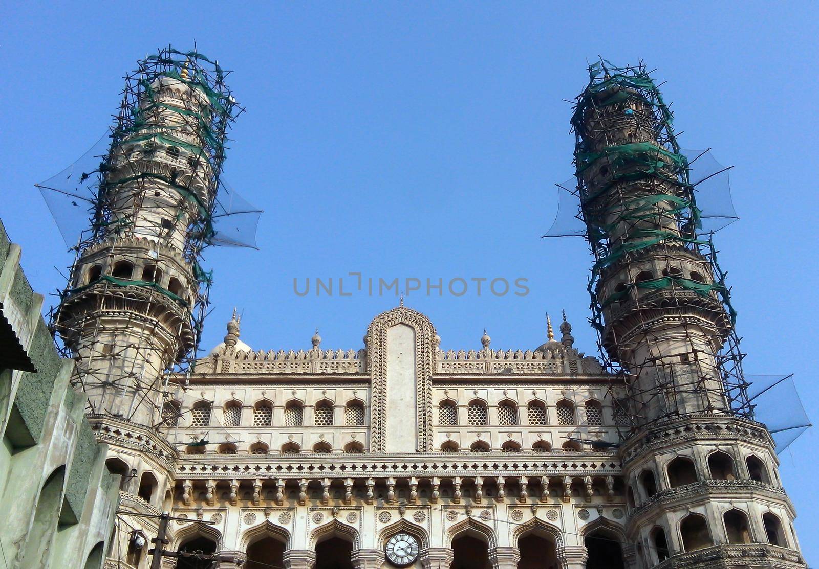 Hyderabad City, Andhra Pradesh, India- November 18, 2016: Editorial: Pedestrians walking at the street of Hyderabad with background of Charminar, which is a monument and mosque,constructed in 1591.