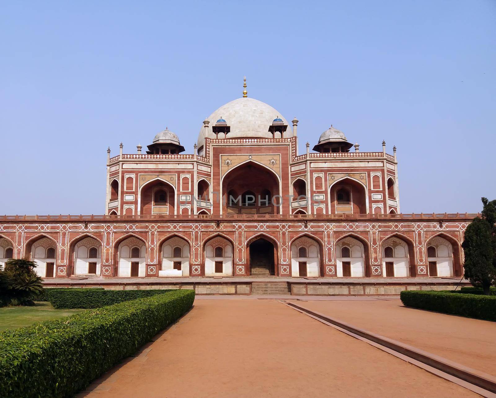 Delhi, India - Feb 13, 2021: Facade of Humayun’s Tomb against a blue sky in Delhi by tabishere