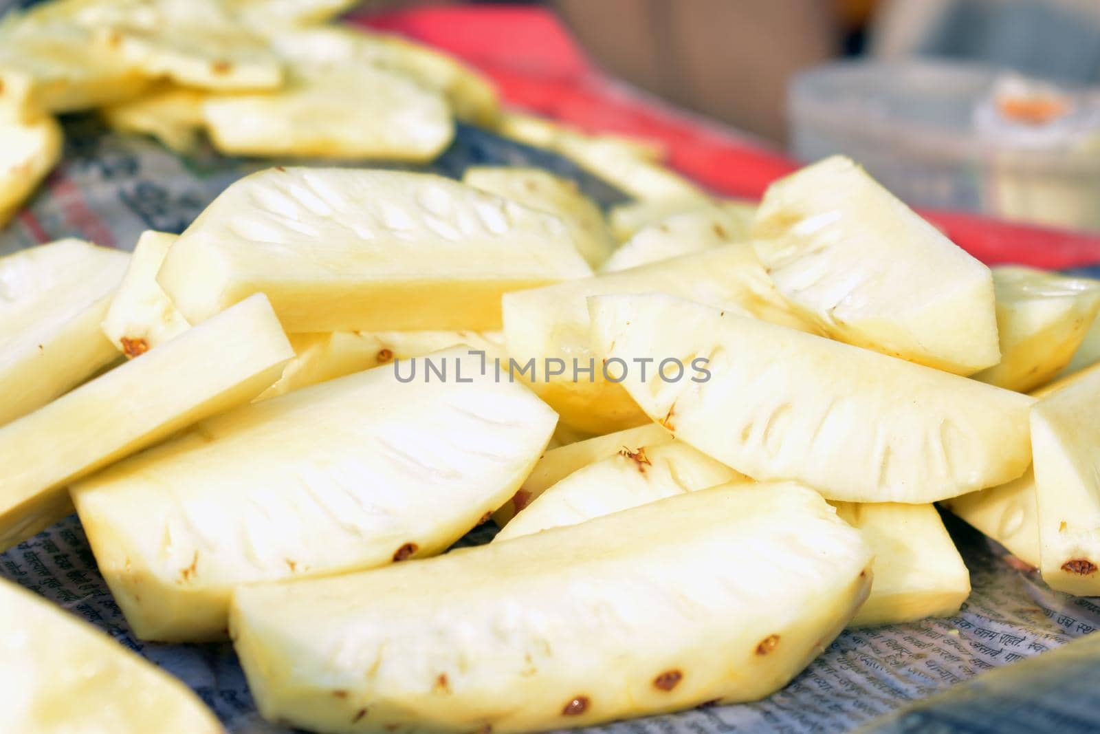 Pineapple slices with leaves.Cut pineapple on white. by tabishere