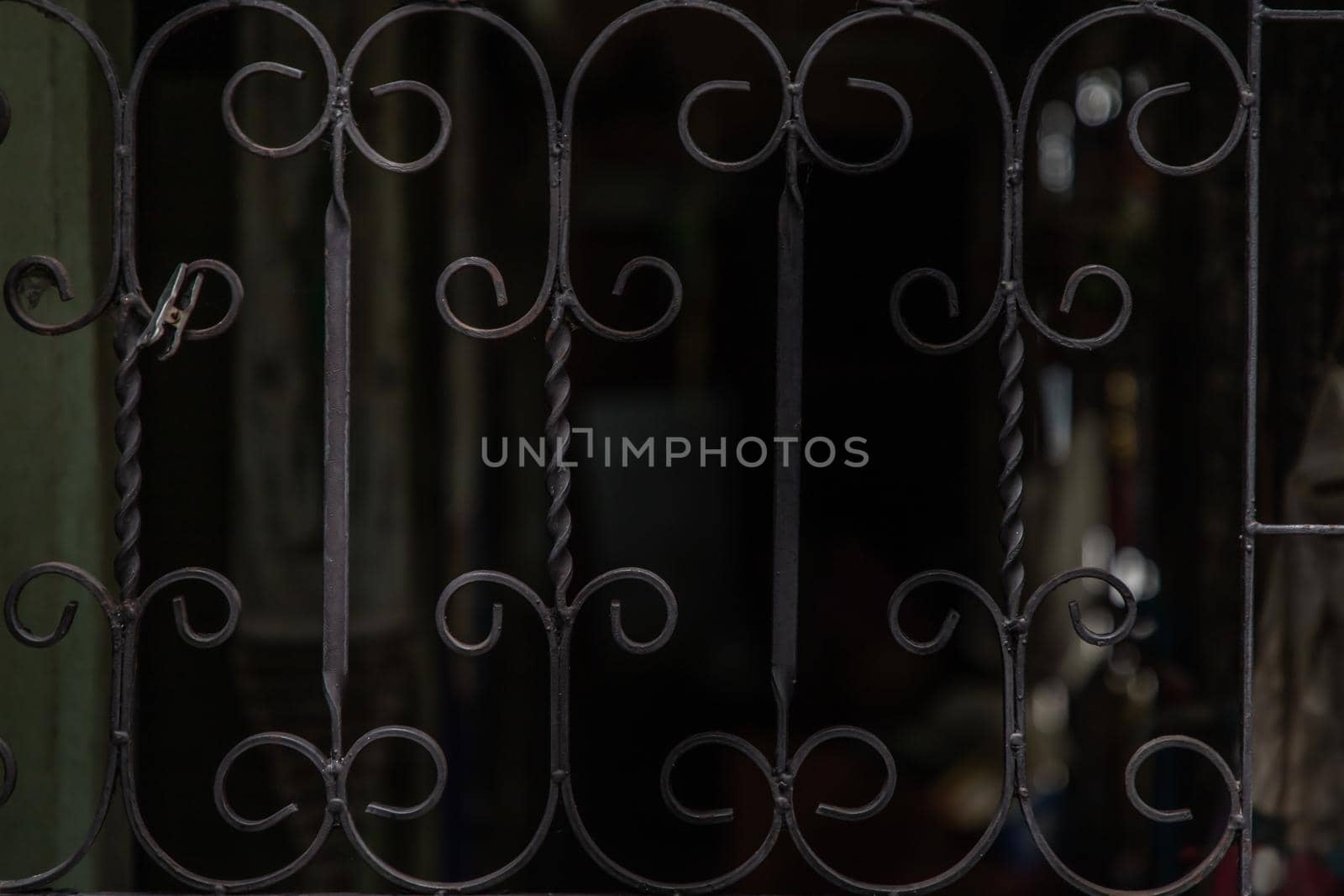 The iron banister elements of window. Home decoration. Copy space.