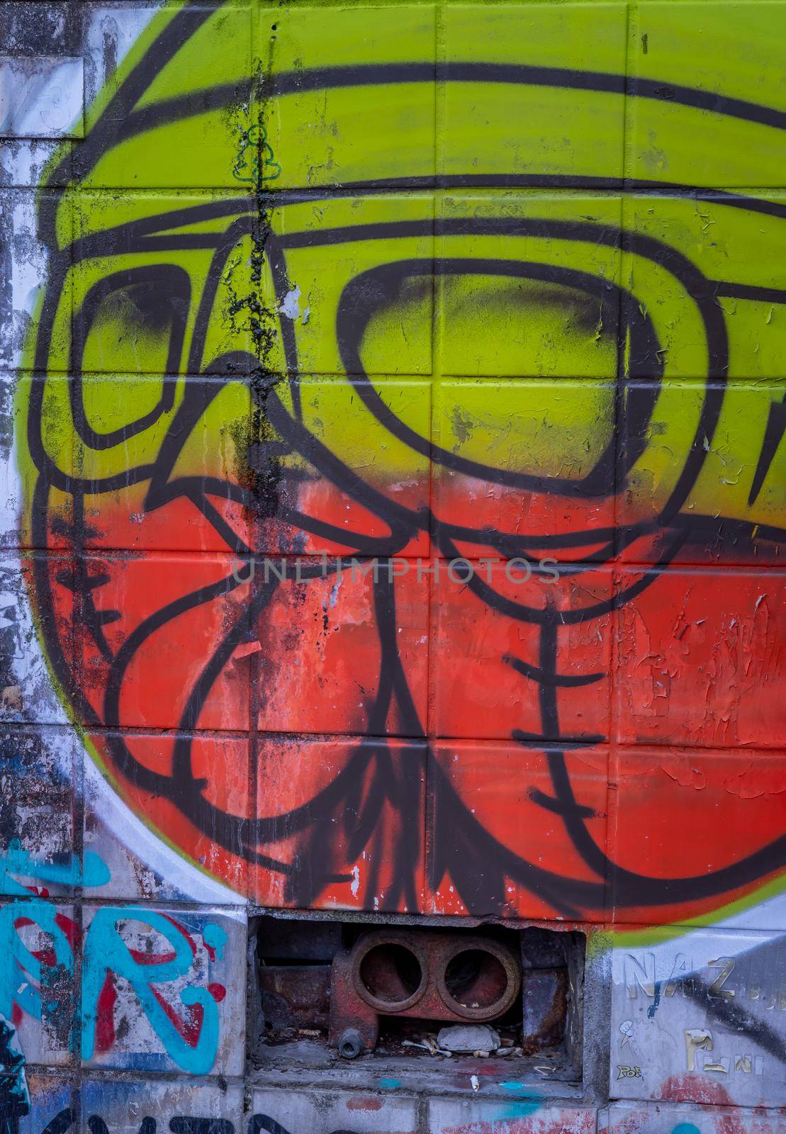 Bangkok, Thailand - Jun 19, 2020 : Graffiti on wall. Abstract creative drawings of fashionable colors on the walls of the city. Urban contemporary culture. Abstract stylish drawing.