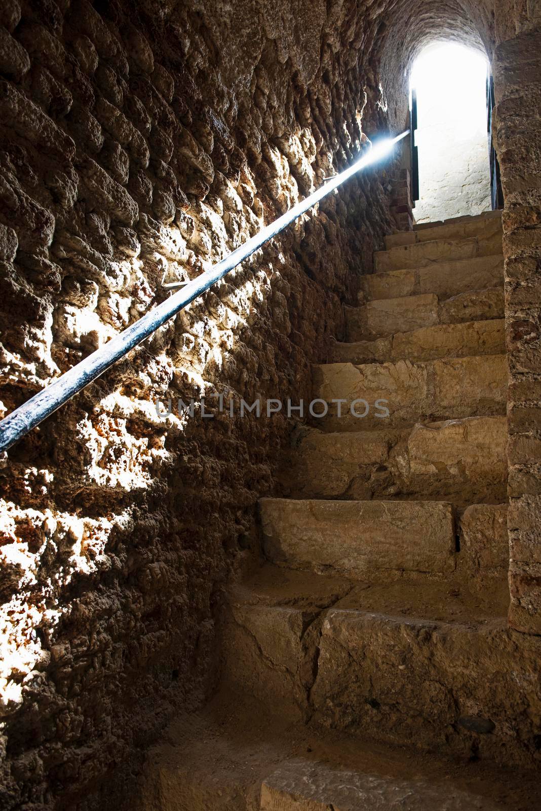 Ancient old stone stairway entrance in ottoman period fort with ray of sunlight at El Quseir Egypt