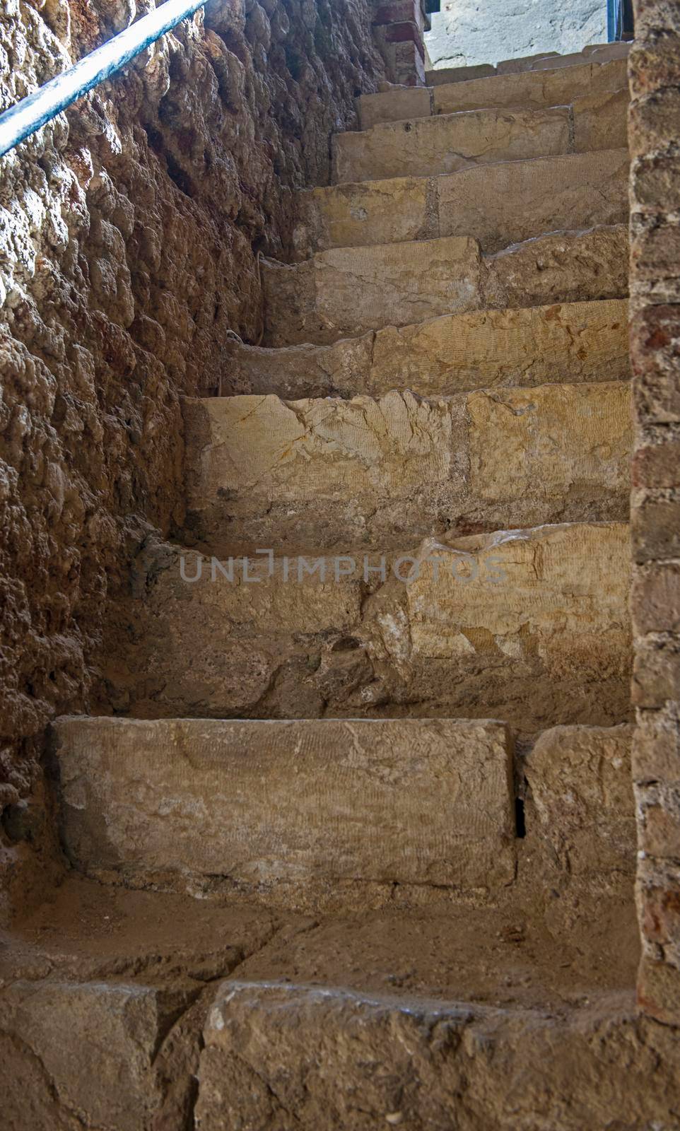 Ancient old stone stairway entrance in ottoman period fort with ray of sunlight at El Quseir Egypt