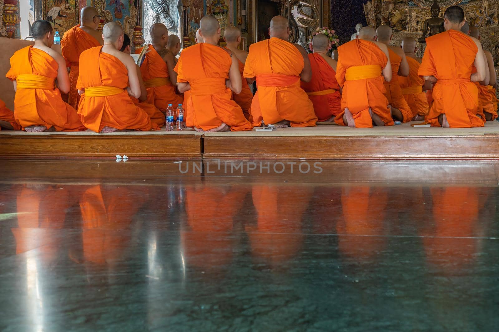 Bangkok, Thailand - Feb 08, 2020 : Buddhist Monks praying and pay respect Buddha statue at Wat Pariwas (Pariwas Temple). Evening Chant. No focus, specifically.