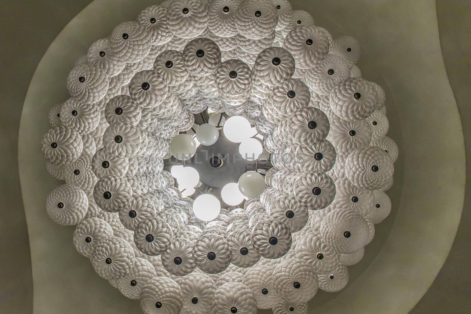 Bottom view of White gorgeous vintage chandelier decoration at Siam Square. Cultural entertainment.