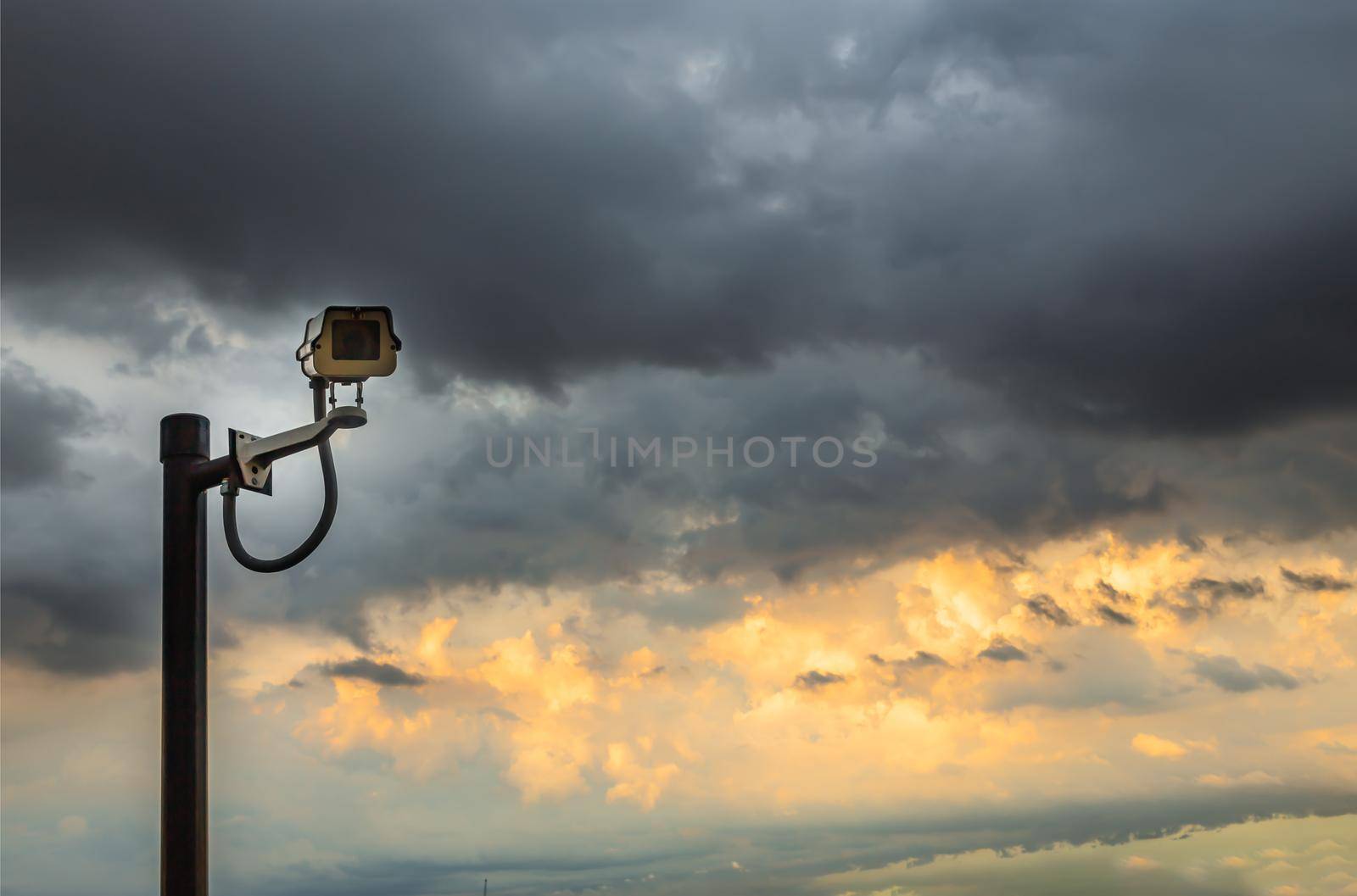 Modern surveillance camera on the sky background. the concept of surveillance and visual inspection that has been developed. copy space. Selective focus.