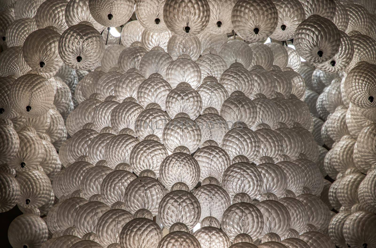 Close-up shot of White gorgeous vintage chandelier decoration.