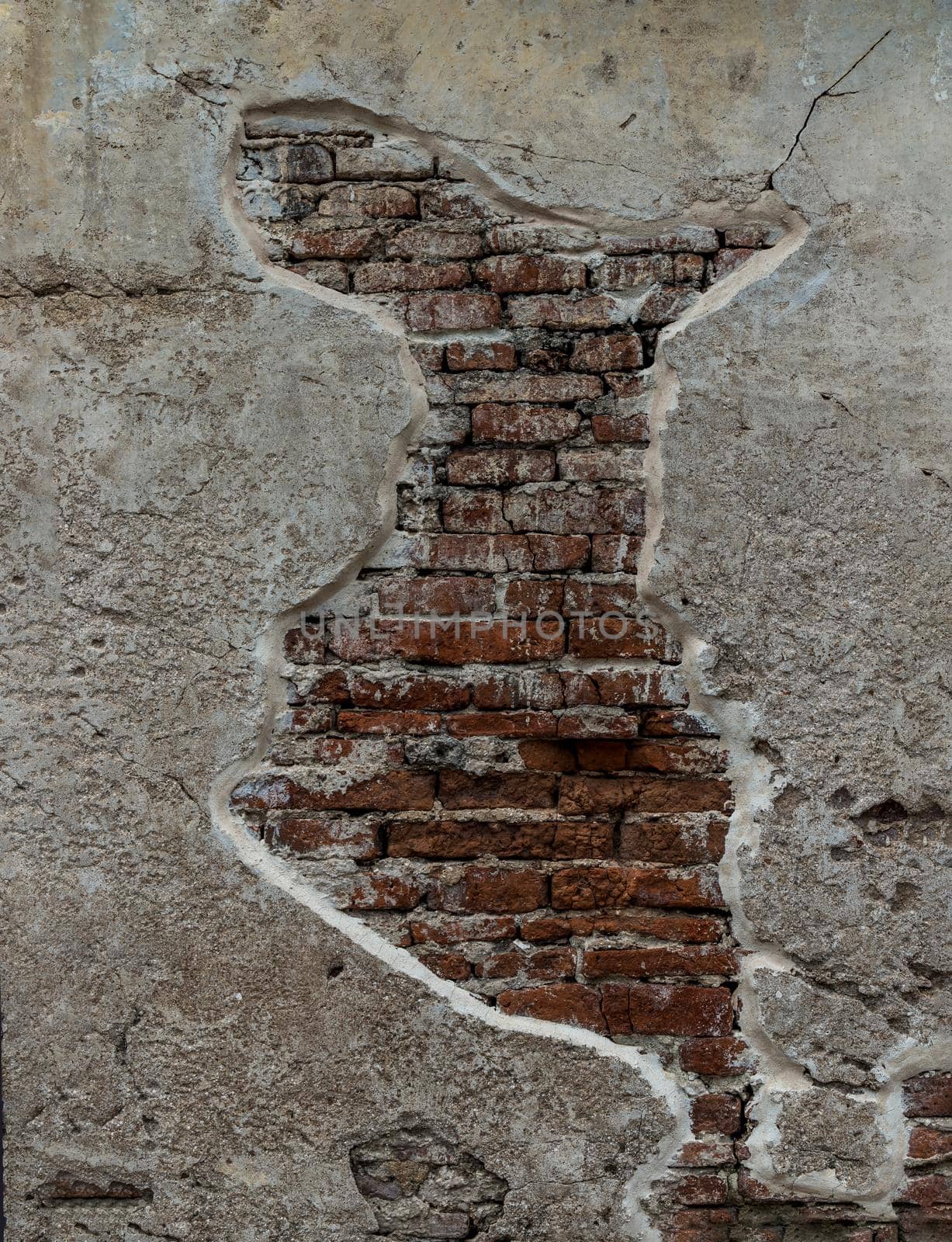 Cracked concrete vintage brick wall background. Archaeological area. Pattern on the wall with space for text, No focus, specifically.