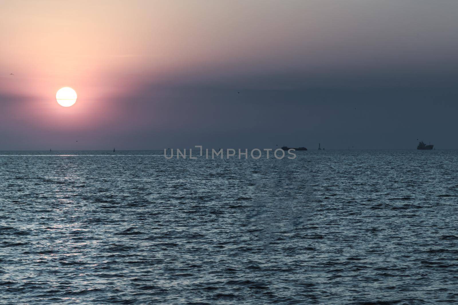 Beautiful sunset over a calm sea. Space for text, Selective focus.