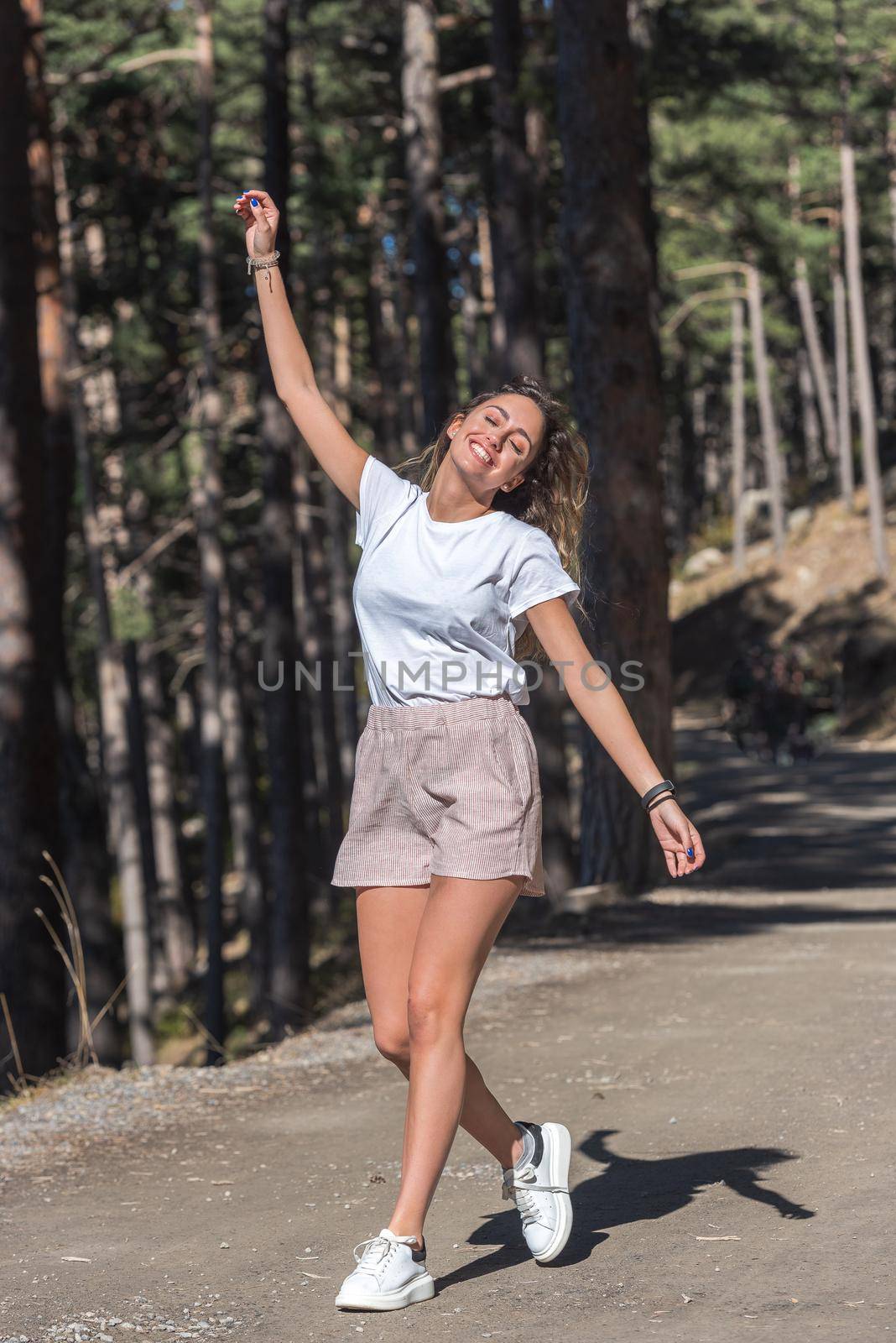 Pretty girl with curly hair in summer. by martinscphoto