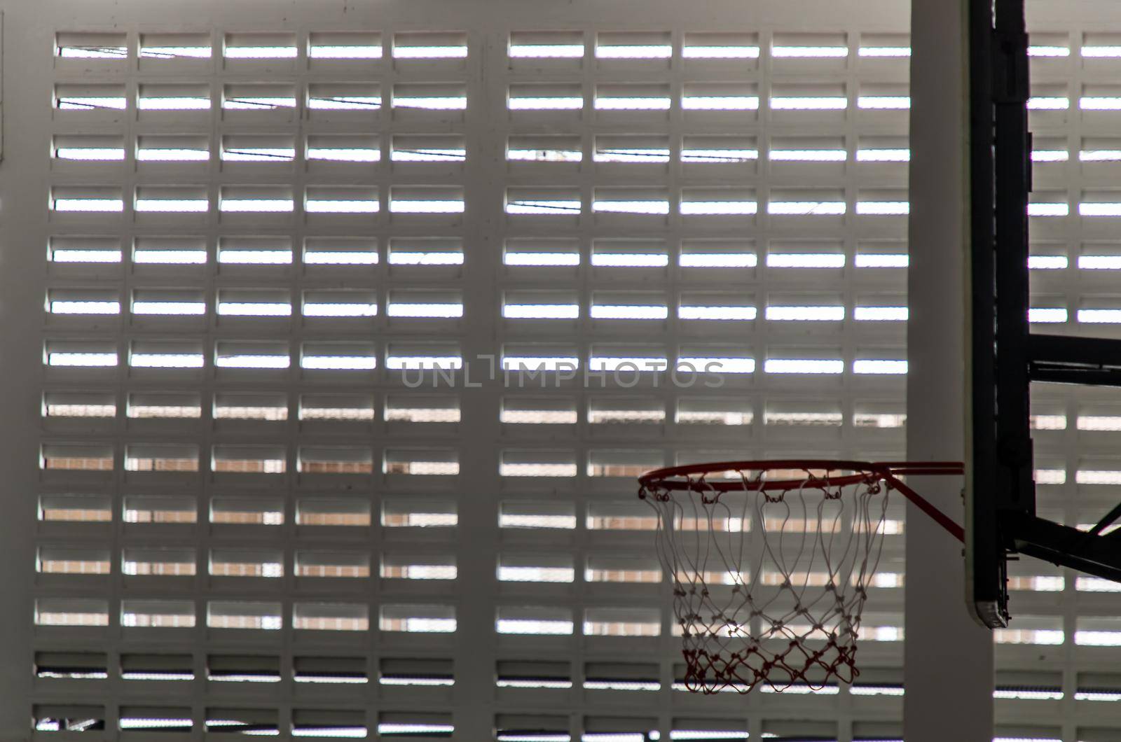 indoor sport basketball hoop in gym. Interior of a basketball hall. Copy space, Selective focus.