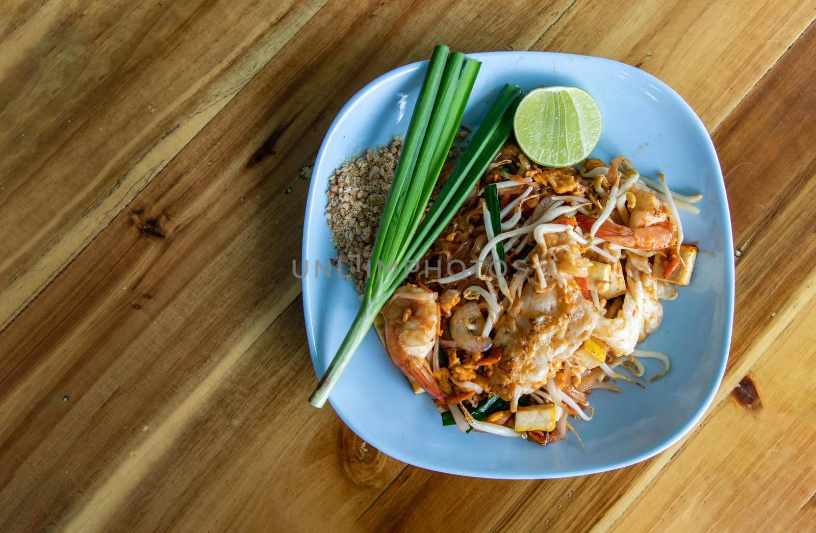 Fried Thai Noodle with Shrimp or Pad Thai Goong Sod. That popular food for foreigner tourists. Top view, Copy Space, No focus, specifically.