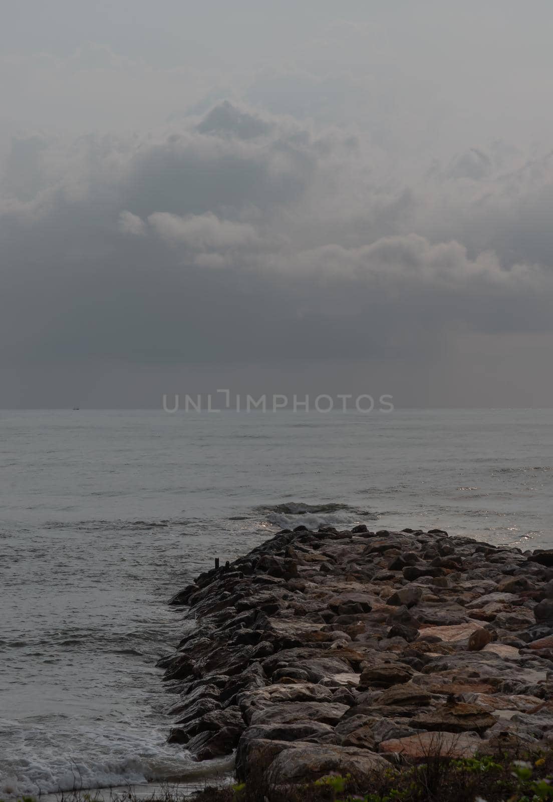 Rocks and sea : View of sea waves hitting rocks on the Calm beach in the morning. Focus and blur.