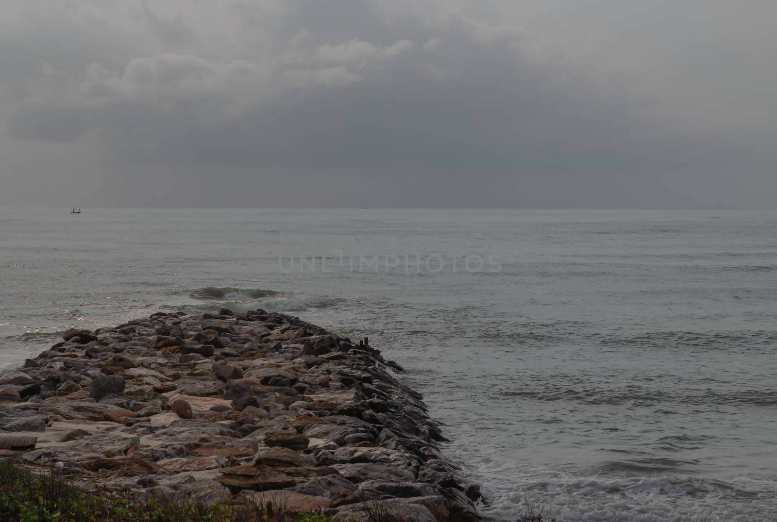 Rocks and sea : View of sea waves hitting rocks on the Calm beach in the morning. Focus and blur.