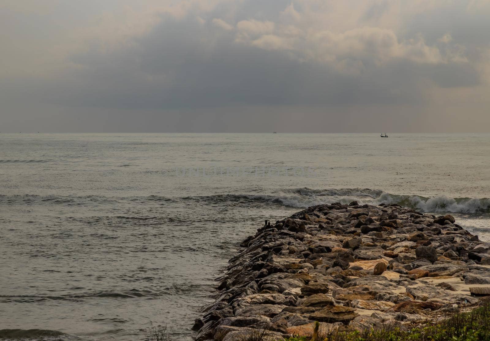 Rocks and sea : View of sea waves hitting rocks on the Calm beach in the morning. Focus and blur.