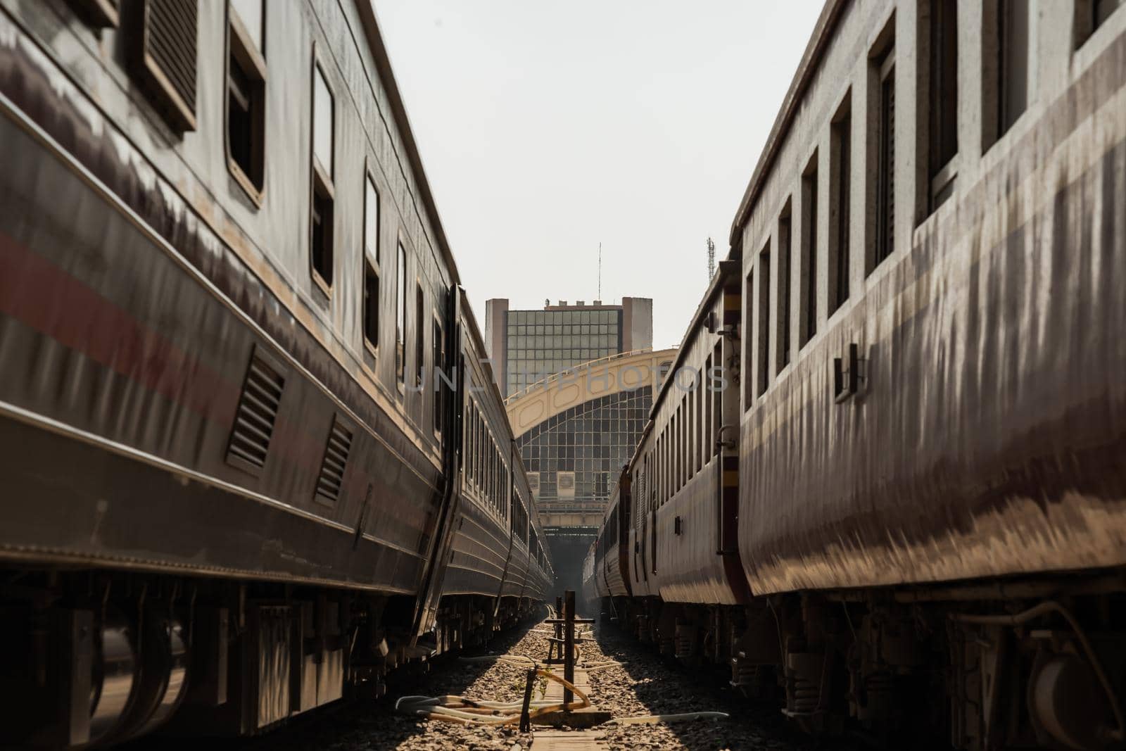Two train is parked at platform waiting for passengers in hua lamphong railway station. the main railway station of Thailand located in the center of Bangkok. Focus and blur.
