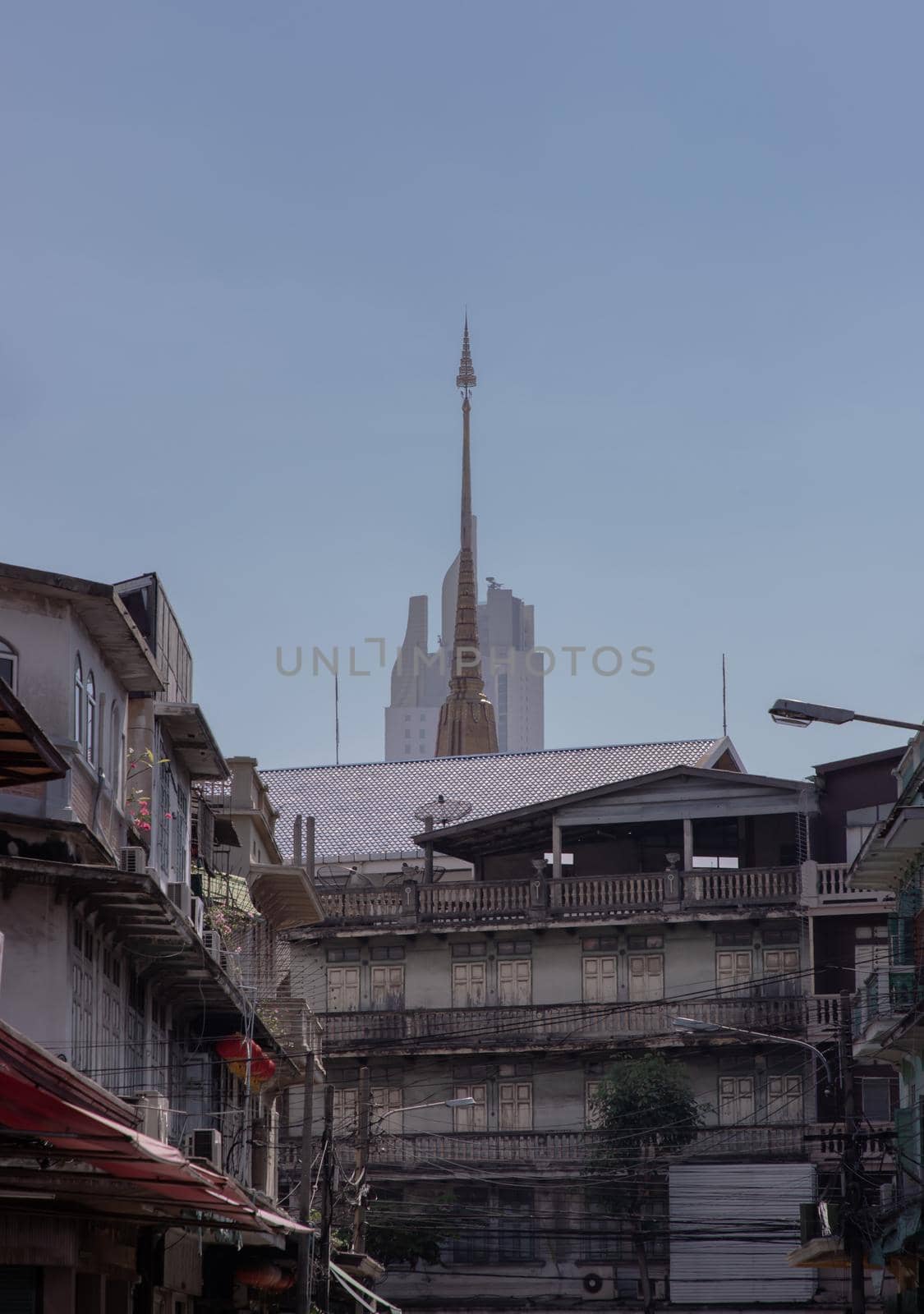 City view of Bangkok with House and Modern tall building and Thai temple that perfectly coexist. No focus, specifically.