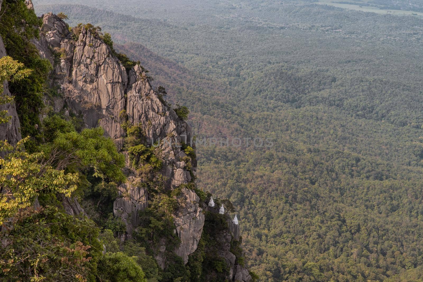 Lampang, Thailand - Sep 03, 2020 : Pagoda on top of the cliff high mountain at Chaloem Phrakiat Phrachomklao Rachanuson temple (Wat Phrabat Pu Pha Daeng) Chae-Hom District, Lampang province, Unseen and Amazing temple in Thailand. Selective focus.