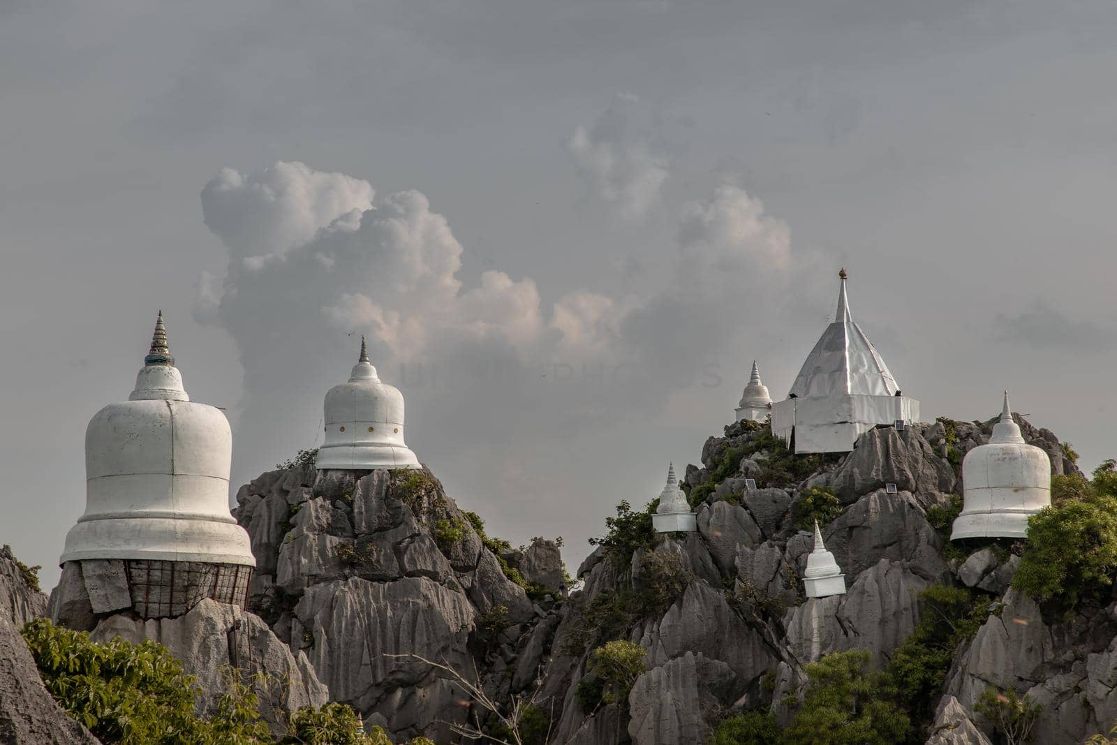 Lampang, Thailand - Sep 03, 2020 : Pagoda on top of the cliff high mountain at Chaloem Phrakiat Phrachomklao Rachanuson temple (Wat Phrabat Pu Pha Daeng) Chae-Hom District, Lampang province, Unseen and Amazing temple in Thailand. Selective focus.