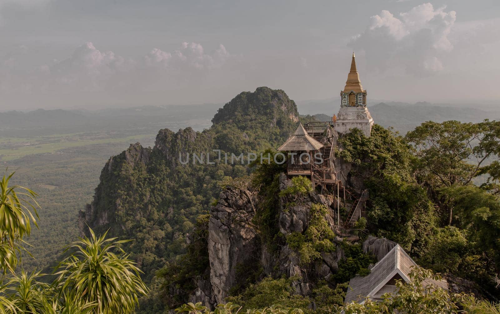Lampang, Thailand - Sep 03, 2020 : Pagoda on top of the cliff high mountain at Chaloem Phrakiat Phrachomklao Rachanuson temple (Wat Phrabat Pu Pha Daeng) Chae-Hom District, Lampang province, Unseen and Amazing temple in Thailand. Selective focus.