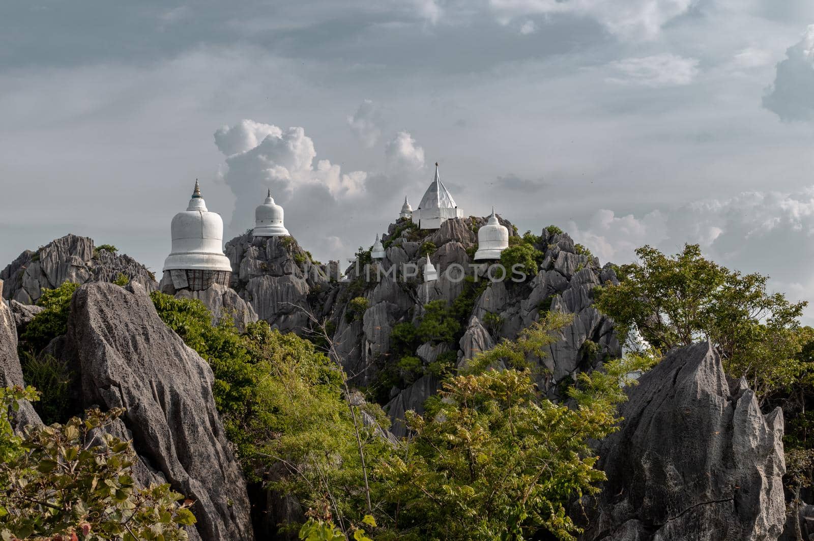 Lampang, Thailand - Sep 03, 2020 : Pagoda on top of the cliff high mountain at Chaloem Phrakiat Phrachomklao Rachanuson temple (Wat Phrabat Pu Pha Daeng) Chae-Hom District, Lampang province, Unseen and Amazing temple in Thailand. Selective focus.