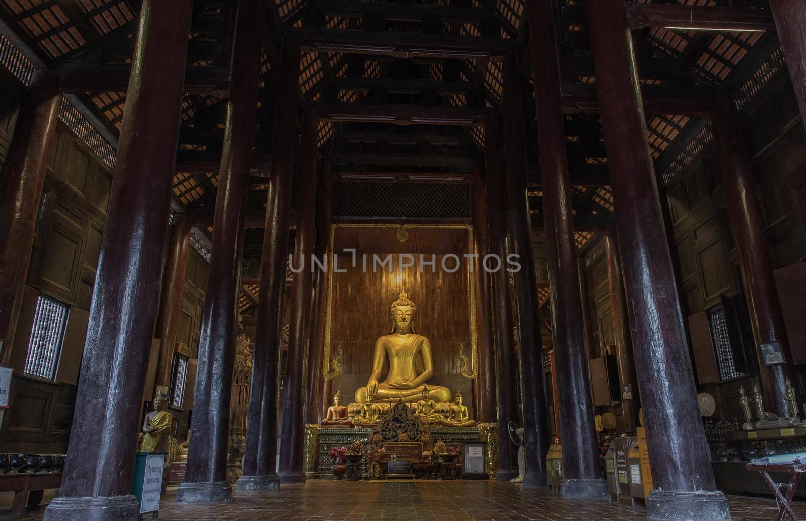 Chiangmai, Thailand - Sep 07, 2020 : The buddha image in main vihan at wat phun tao. Wat phan tao is a beautiful wooden temple in chiang mai. Selective focus.