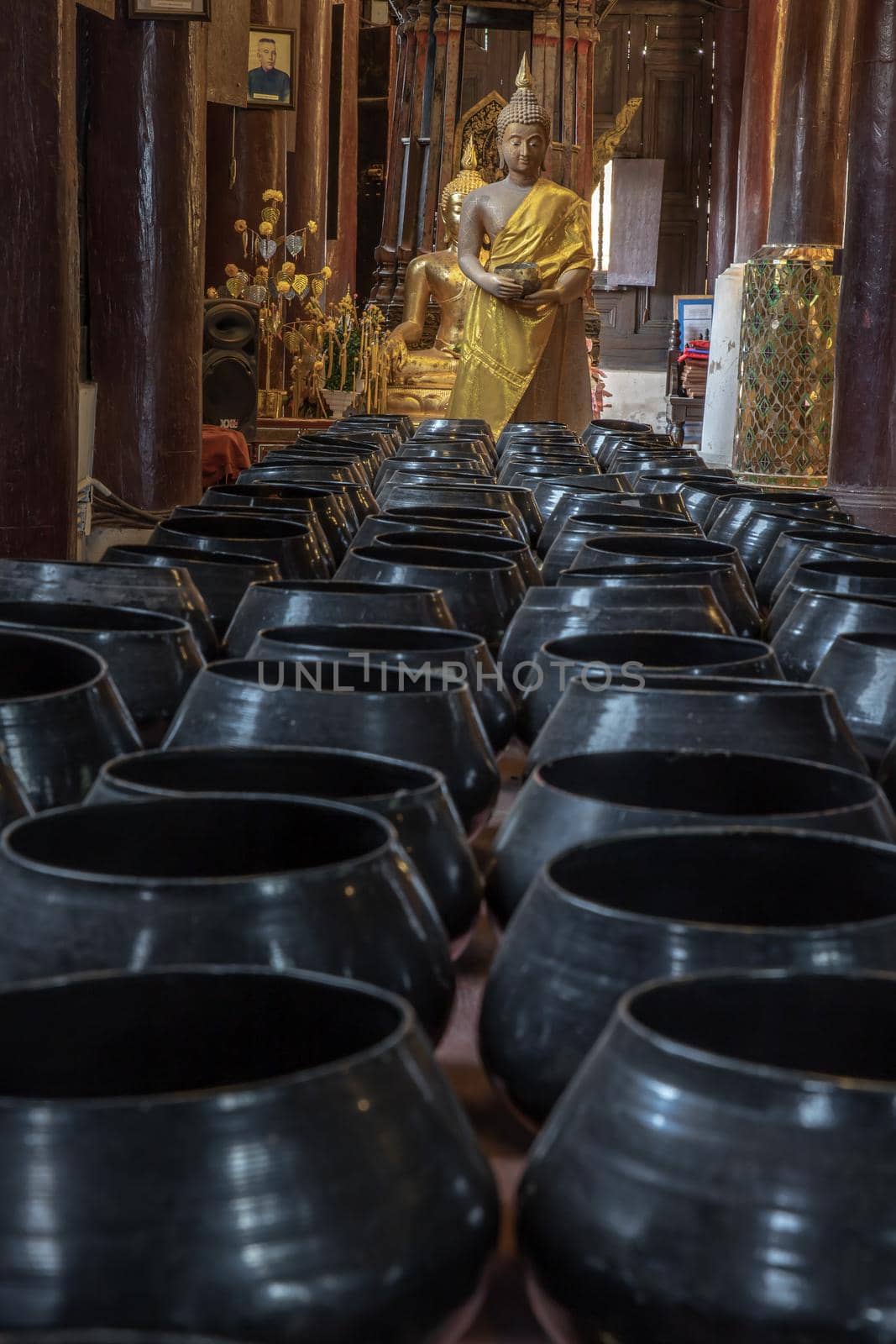 Chiangmai, Thailand - Sep 07, 2020 : The buddha image and 
monk's alms bowl in main vihan at wat phun tao. Selective focus.