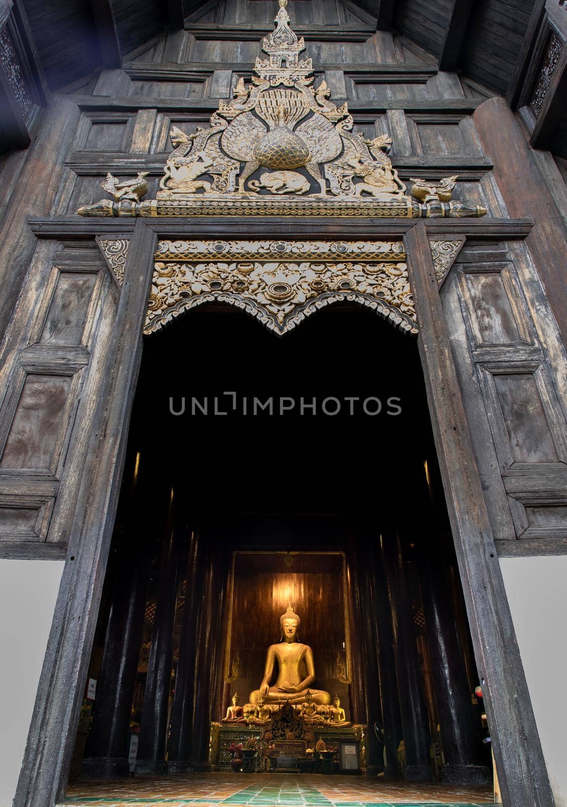 Chiangmai, Thailand - Sep 07, 2020 : The buddha image in main vihan at wat phun tao. Wat phan tao is a beautiful wooden temple in chiang mai. Selective focus.