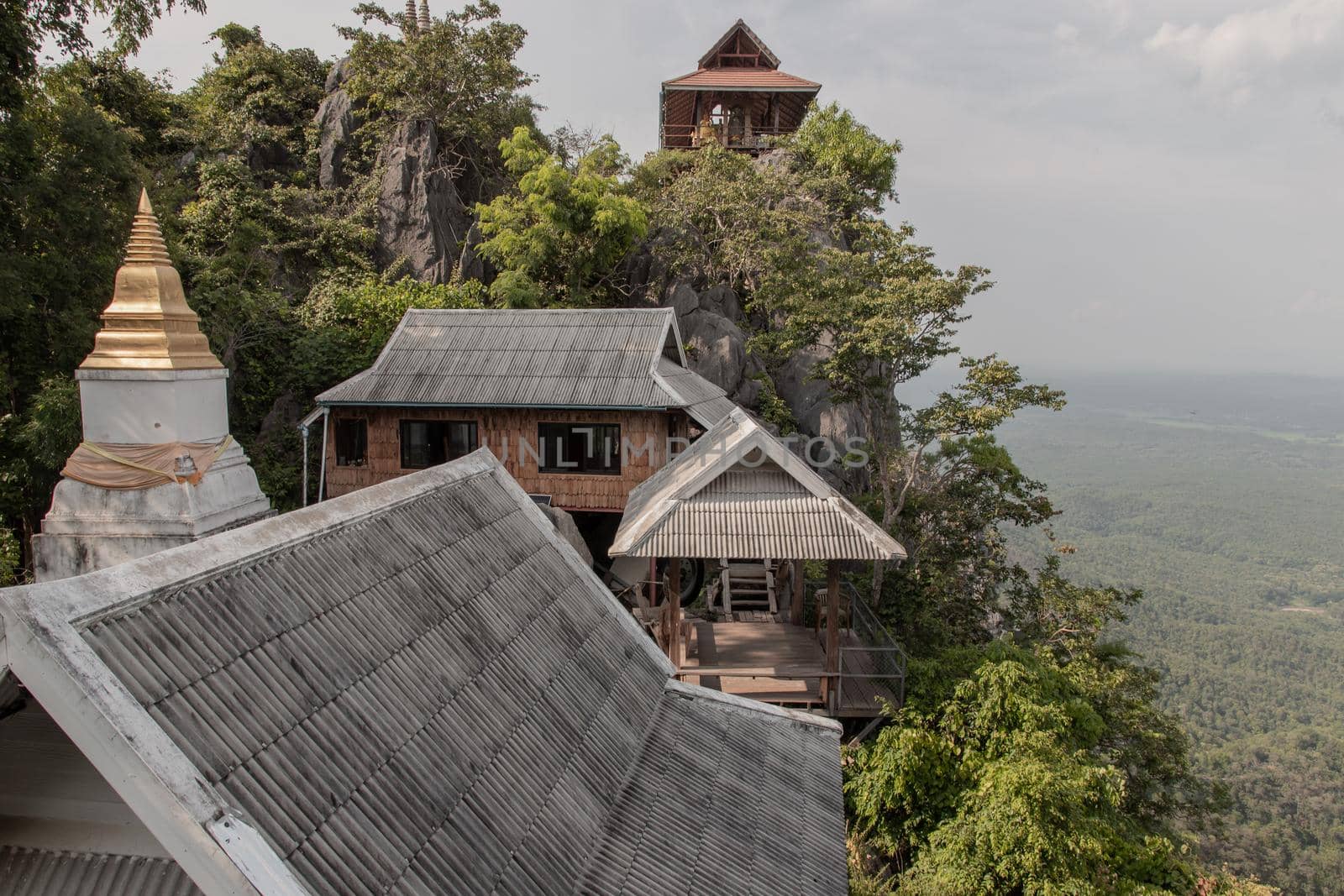 Lampang, Thailand - Sep 03, 2020 : Pagoda on top of the cliff high mountain at Chaloem Phrakiat Phrachomklao Rachanuson temple (Wat Phrabat Pu Pha Daeng) Chae-Hom District, Lampang province, Unseen and Amazing temple in Thailand. Selective focus.