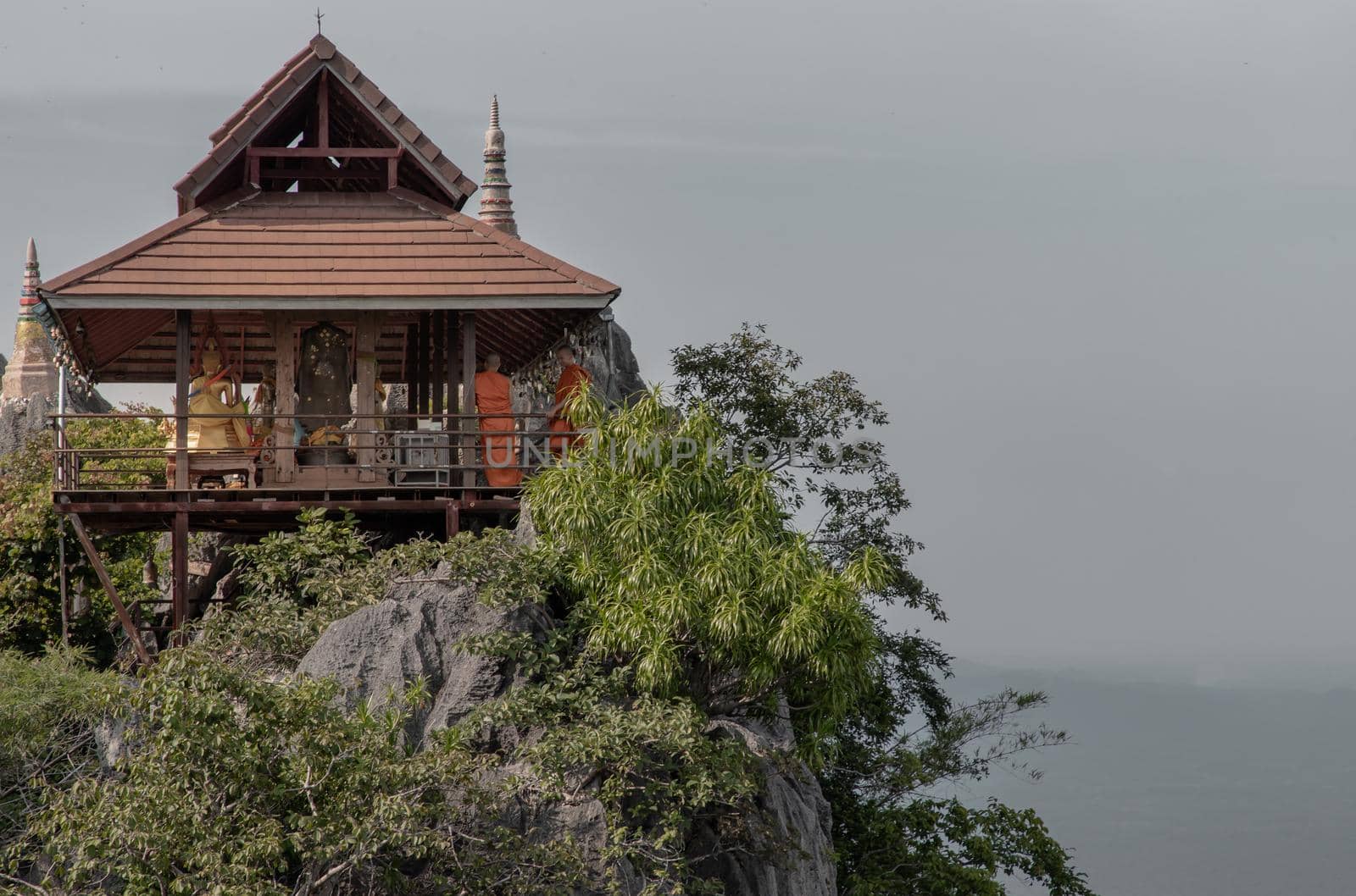 Lampang, Thailand - Sep 03, 2020 : Pagoda on top of the cliff high mountain at Chaloem Phrakiat Phrachomklao Rachanuson temple (Wat Phrabat Pu Pha Daeng) Chae-Hom District, Lampang province, Unseen and Amazing temple in Thailand. Selective focus.