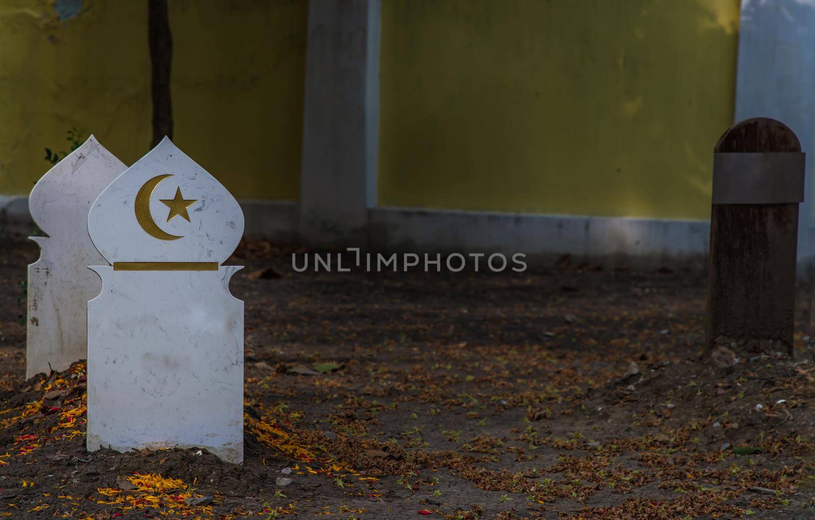Islamic crescent moon with a star on white wooden. waxing moon muslim symbol on Islamic muslim graveyard in thailand.