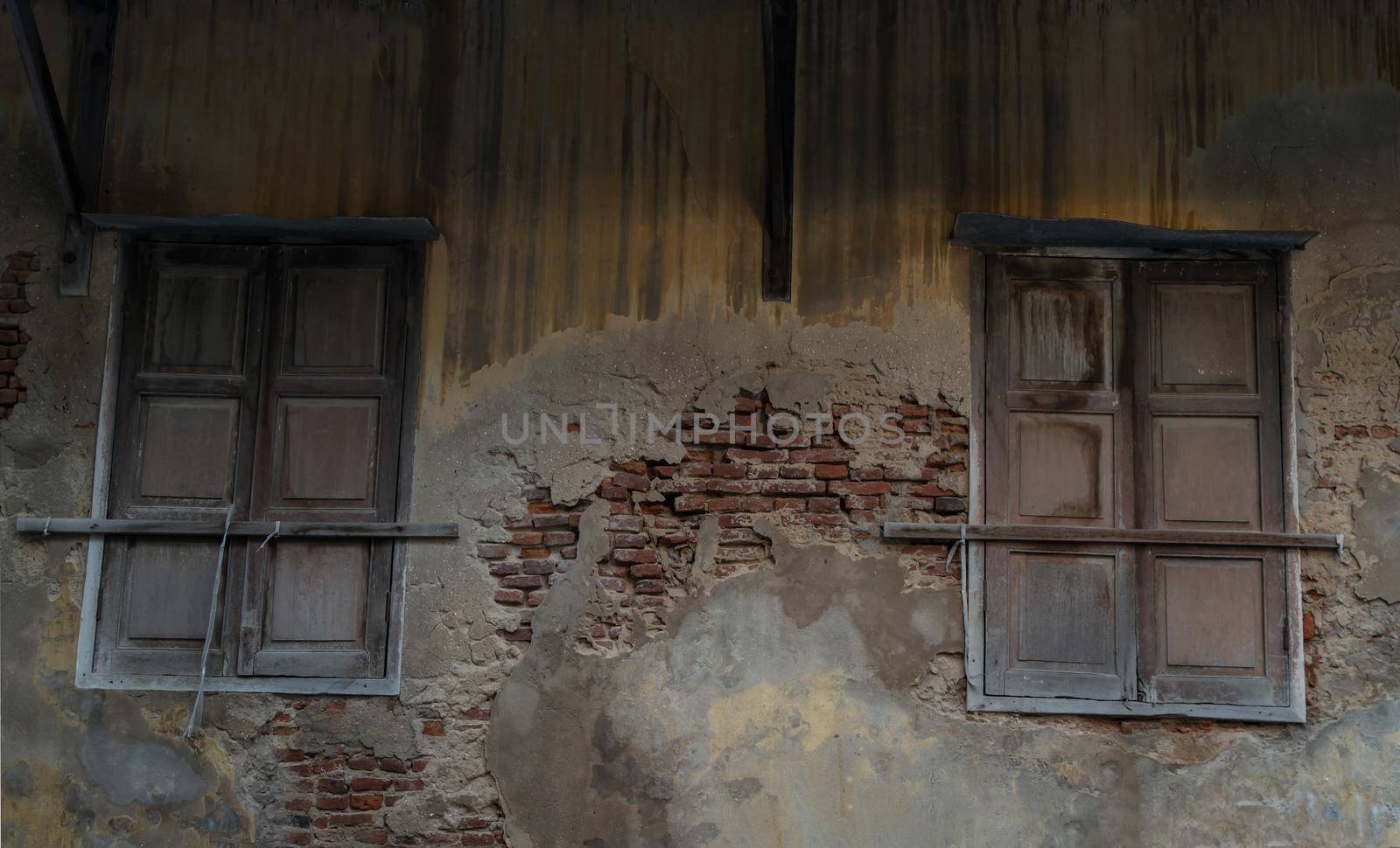 Old wooden windows on the old wall. Traditional Architecture style, Selective focus.