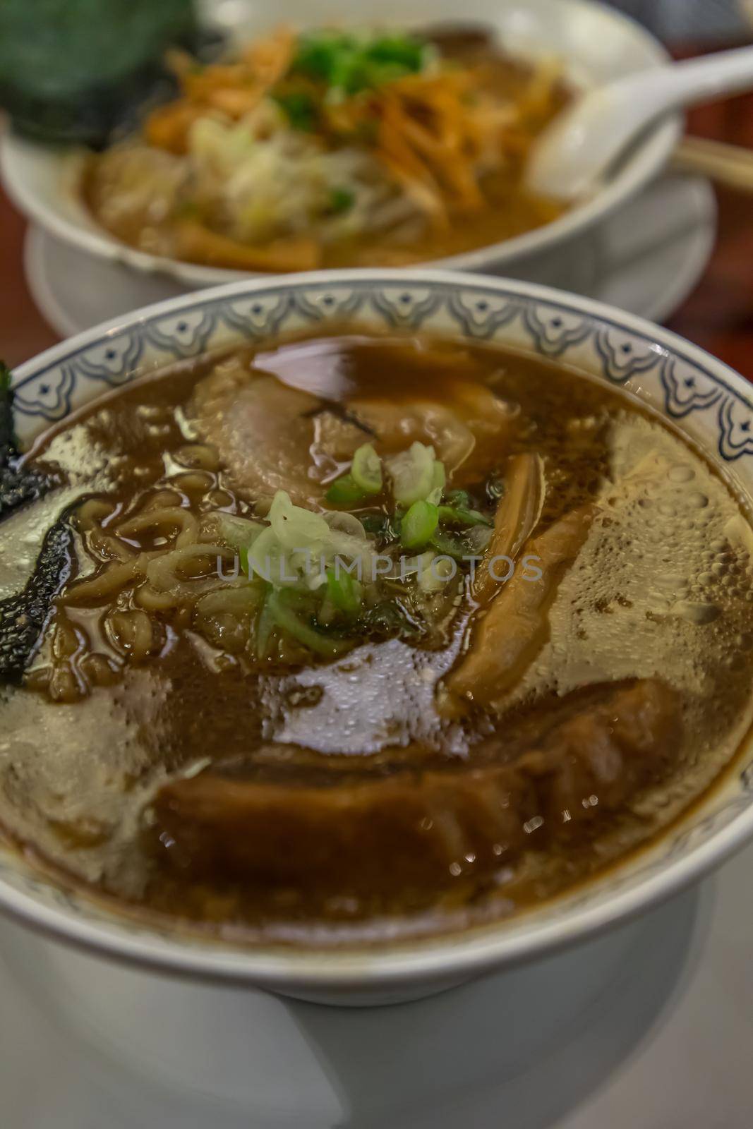 Japanese ramen soup served with chashu pork Japanese bamboo shoots Sliced ​​seaweed and scallions. Japanese food style, Copy space, Selective focus.
