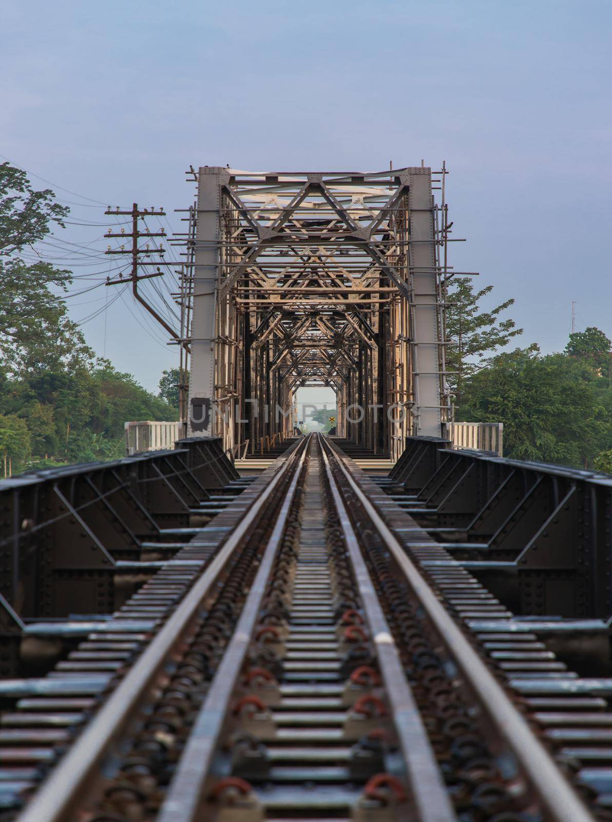 Old railroad tracks on Black Bridge or Lampang Railway Bridge. Railway bridge on river at Lampang thailand. Selective focus.