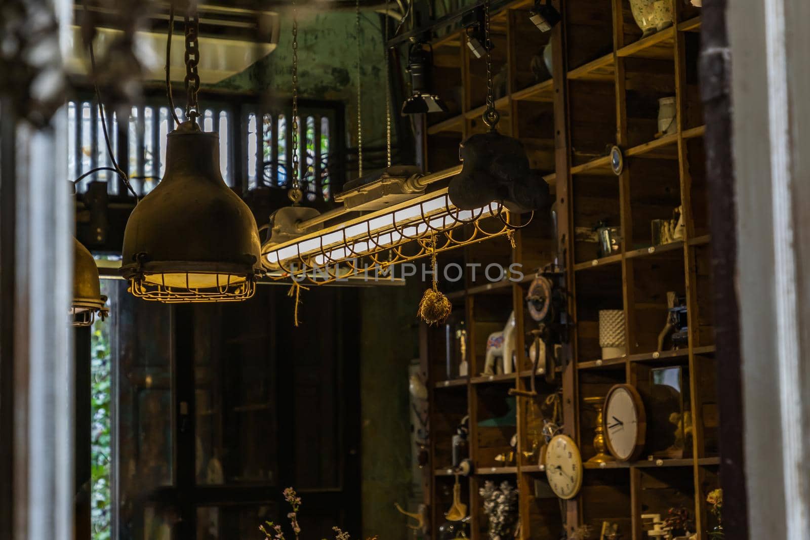 Bangkok, Thailand - Jun 26, 2020 : Vintage Interior design house. Decoration of wooden wall shelves and old lamps. No focus, specifically.