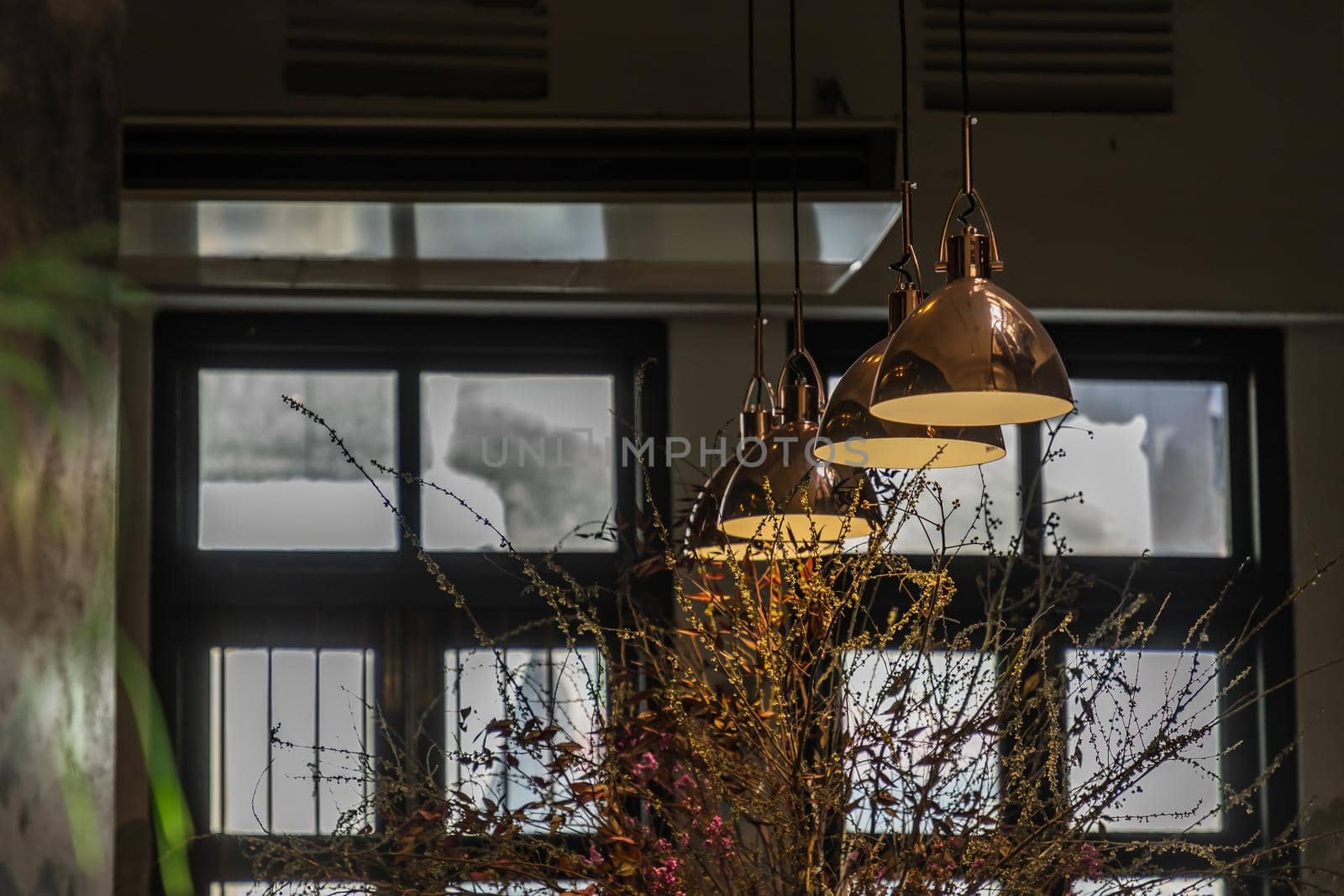 Vintage Interior design room. Decoration of old brick on the wall with vintage lamps and dried flowers. No focus, specifically.