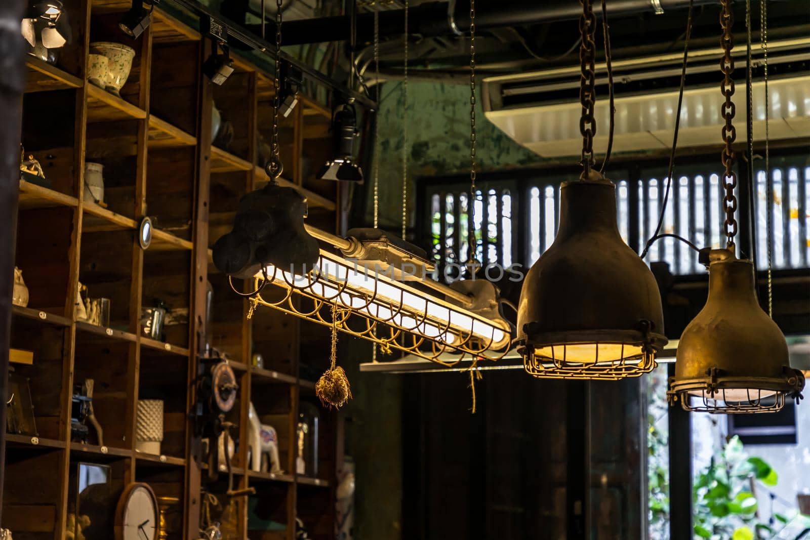 Bangkok, Thailand - Jun 26, 2020 : Vintage Interior design house. Decoration of wooden wall shelves and old lamps. No focus, specifically.