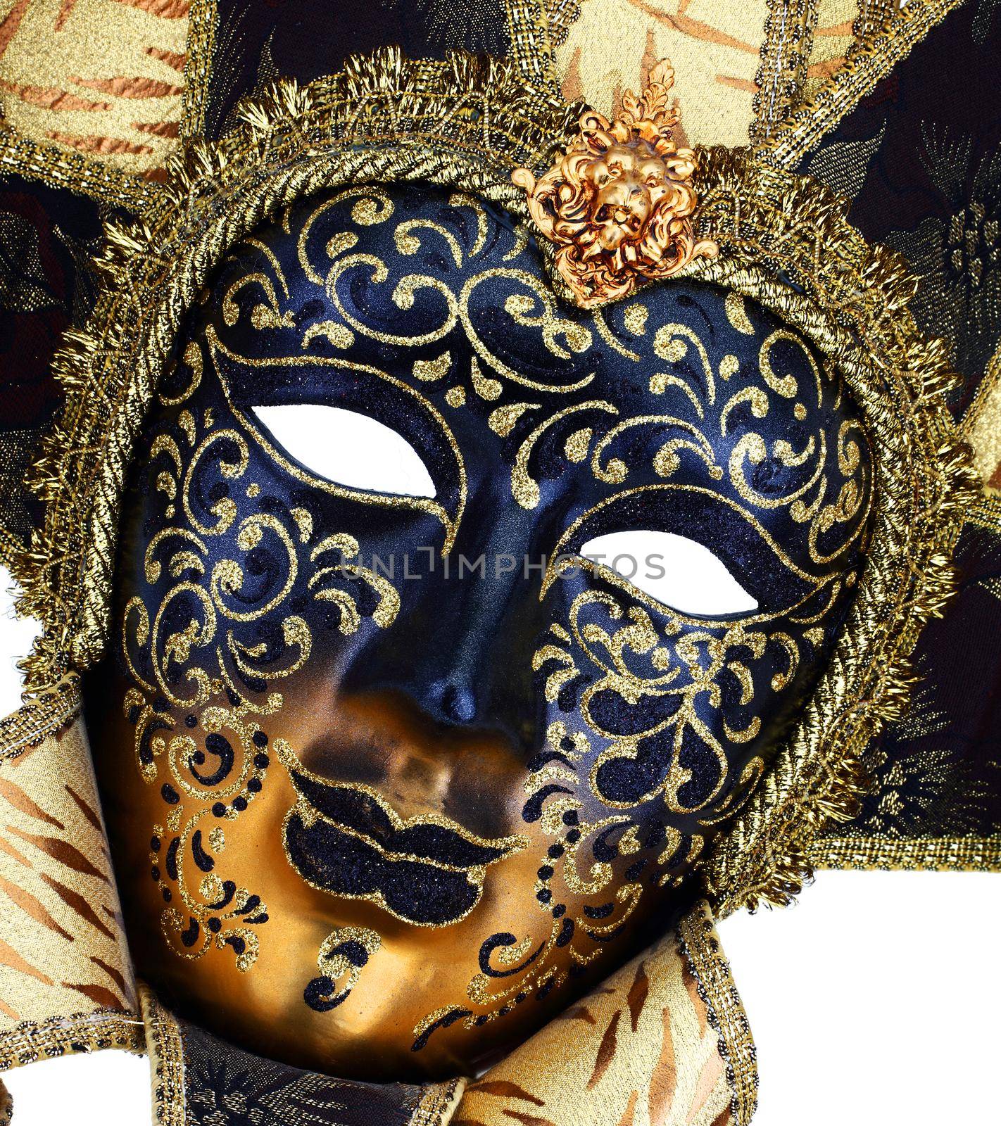 A Black and gold Venetian carnival mask close up
