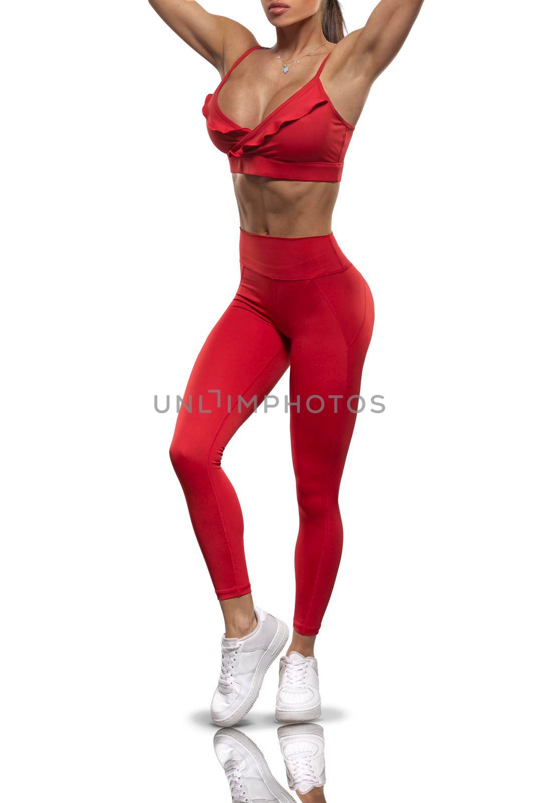 legs girl in red leggings and a top on a white background by but_photo
