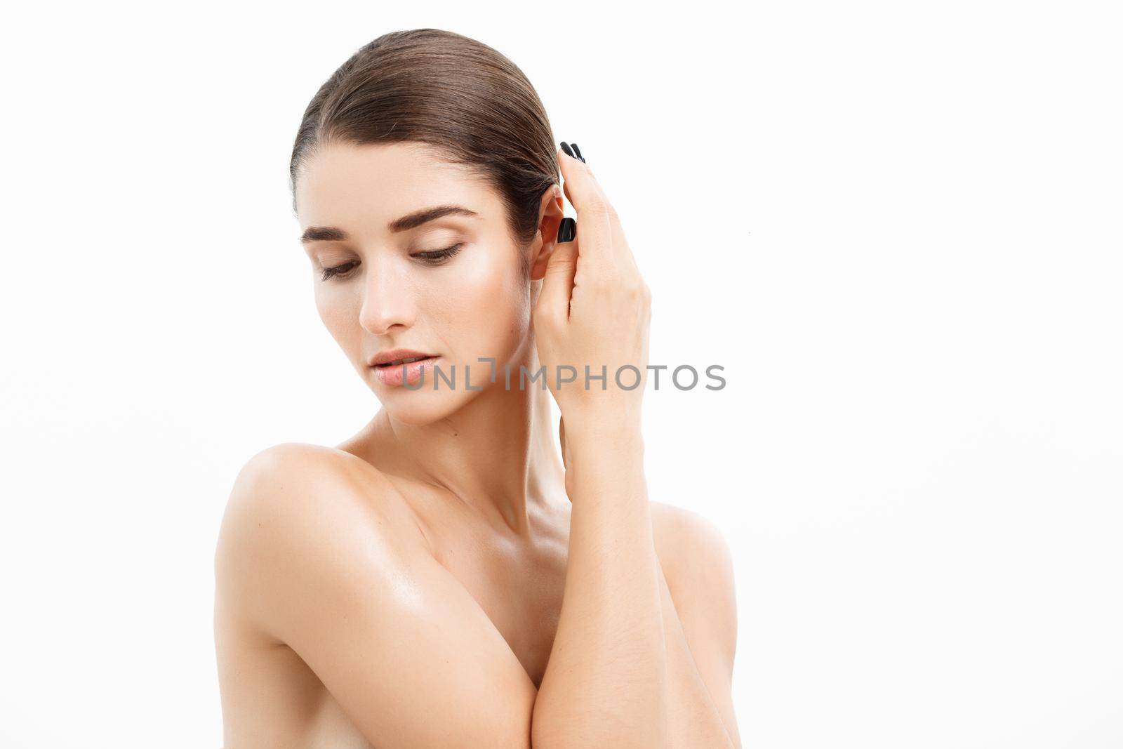 Beauty and spa concept - Charming young woman with perfect clear skin over white background